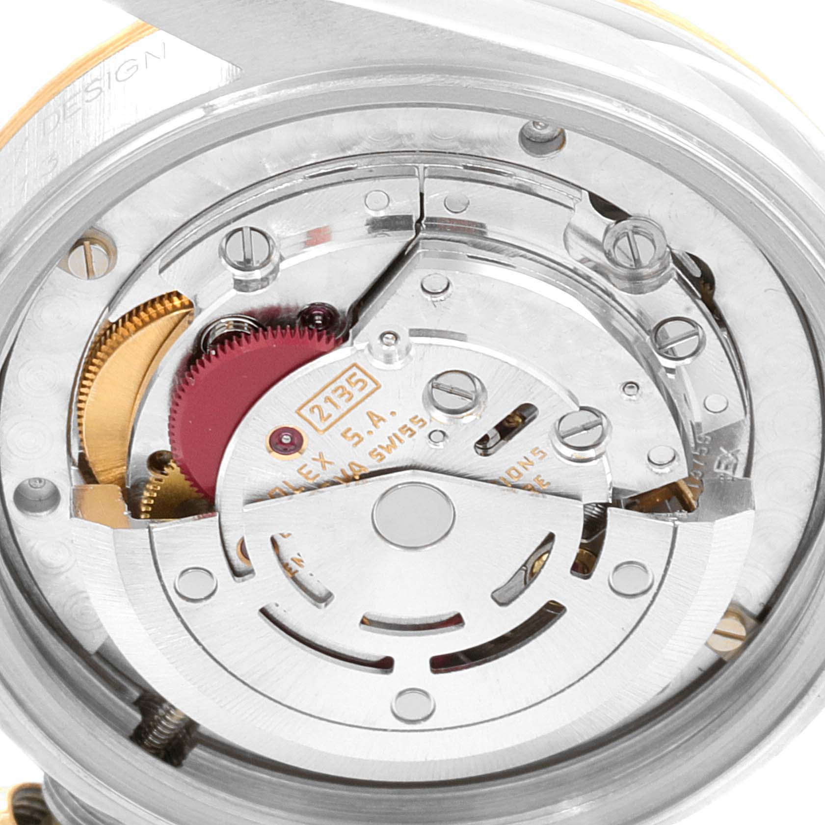 This image shows a close-up of the movement and inner mechanism of a Rolex Mid-Size 68273 Women
s Steel and Gold (two tone) Champagne Dial 68273 Women
s Steel and Gold (two tone) Champagne Dial watch, revealing gears and components.