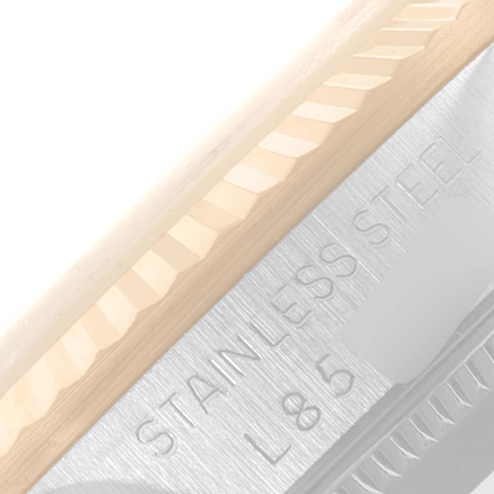 This image shows a close-up of the bezel and part of the side case with inscriptions on the Rolex Mid-Size 68273 Women
s Steel and Gold (two tone) Champagne Dial 68273 Women
s Steel and Gold (two tone) Champagne Dial watch.