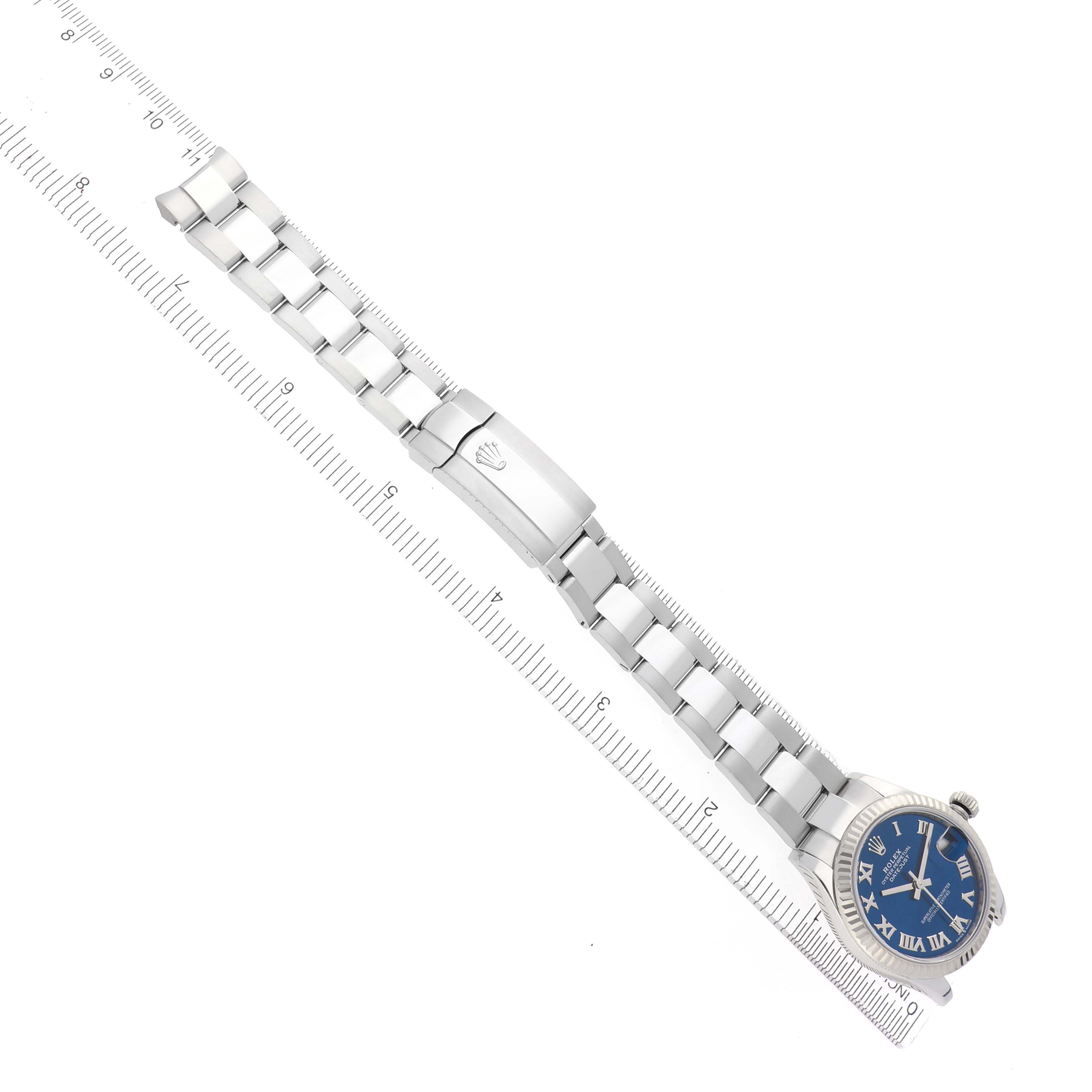 The Rolex Mid-Size 278274 Women
s Stainless Steel Blue Dial 278274 Women
s Stainless Steel Blue Dial watch is shown diagonally with its bracelet, clasp, and blue dial clearly visible.