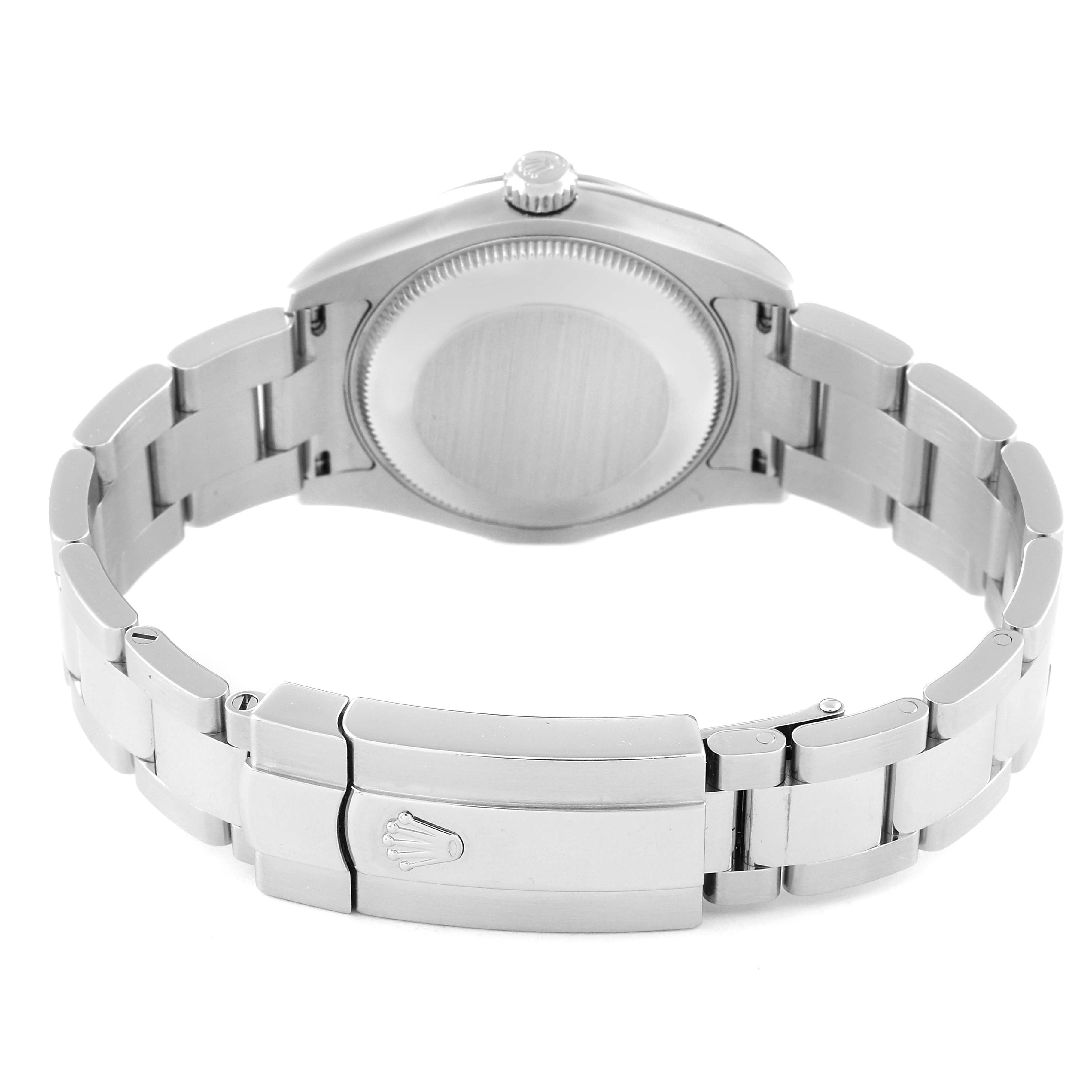 The image shows the back case and stainless steel bracelet of a mid-size Rolex watch, viewed from the bracelet side.