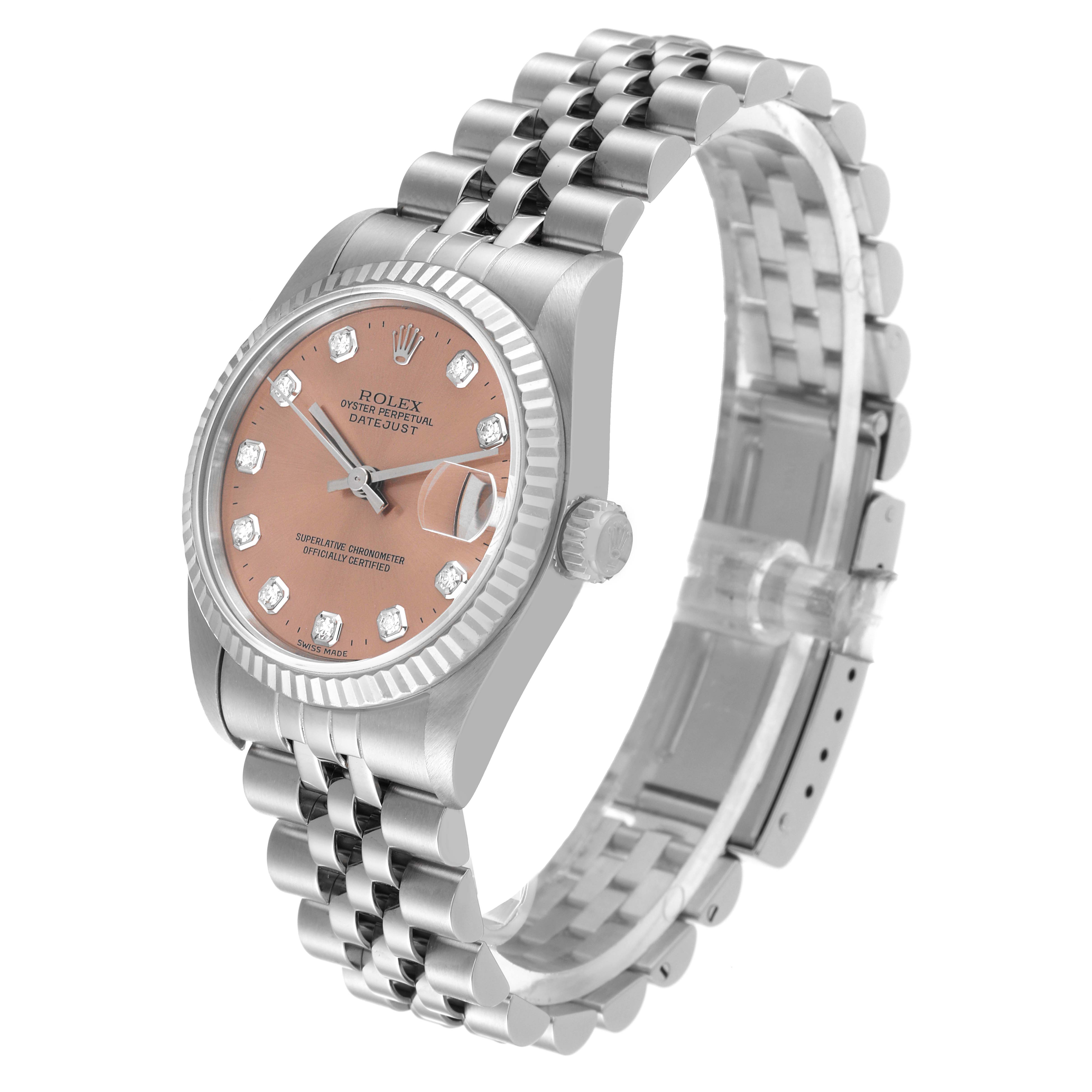 The image shows a side and top angle view of the Rolex Mid-Size 68274 Women
s Stainless Steel Pink Dial 68274 Women
s Stainless Steel Pink Dial Datejust watch, highlighting its bezel, dial, and bracelet.