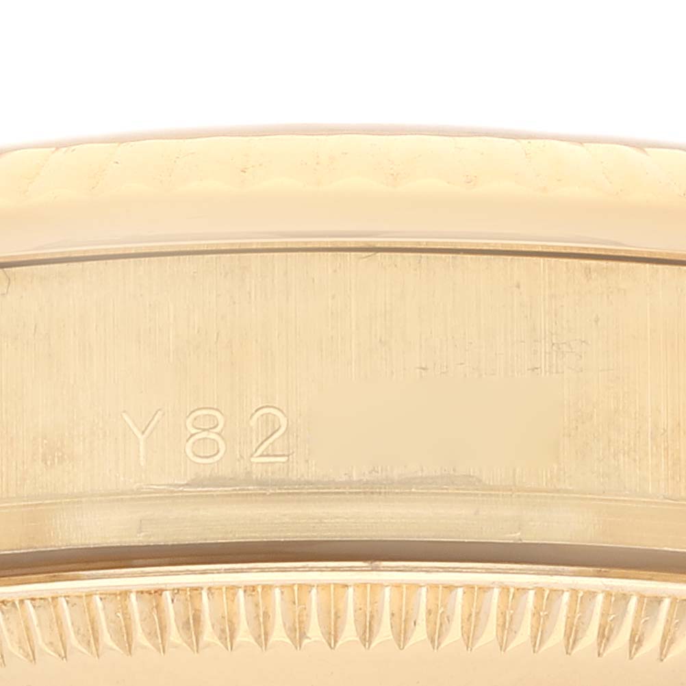 The image shows a close-up view of the side case with engravings on a Rolex President 178278 Women's Yellow Gold Black Dial 178278 Women's Yellow Gold Black Dial model watch.
