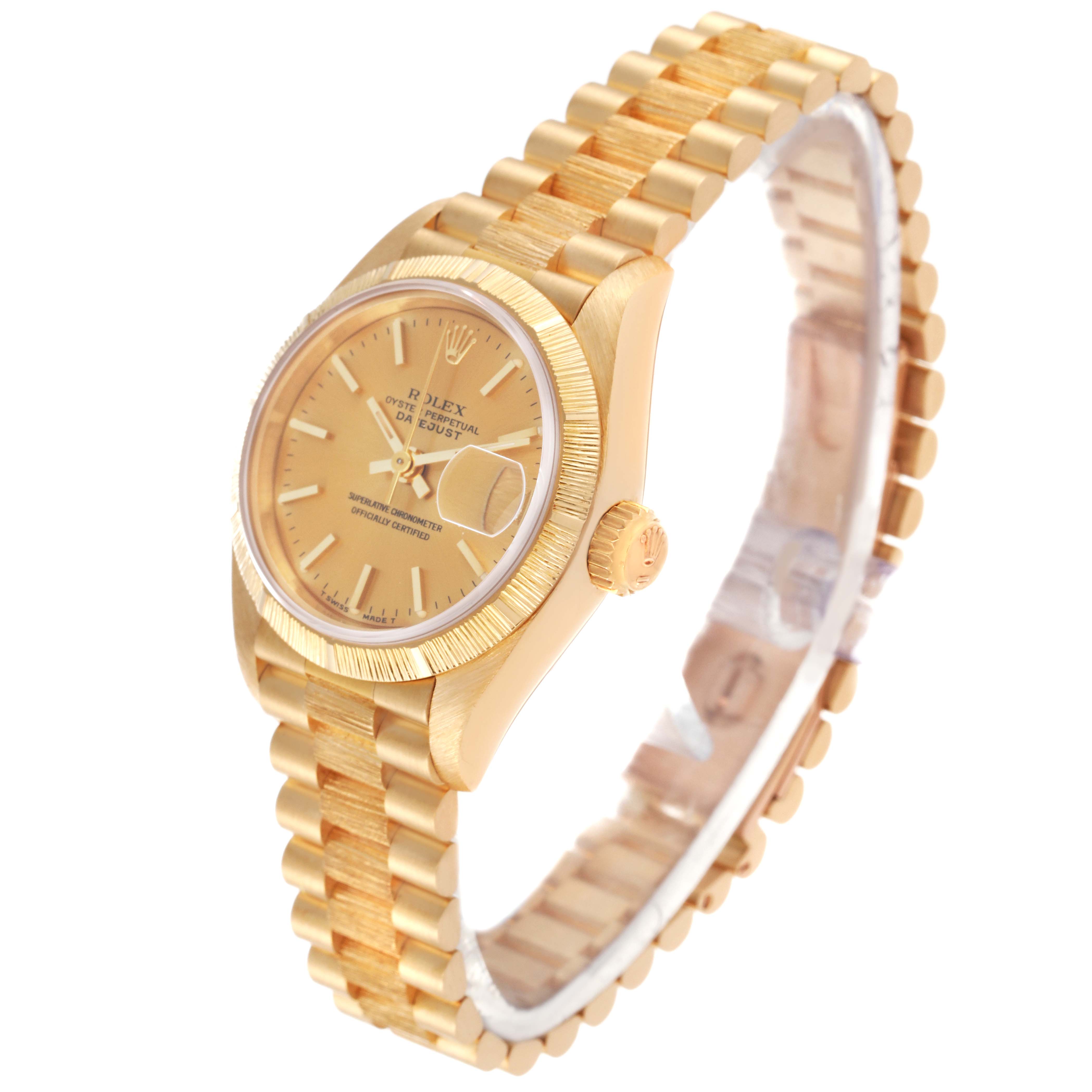 The image shows a side angle of a Rolex President 69278 Women
s Yellow Gold Champagne Dial 69278 Women
s Yellow Gold Champagne Dial model watch, featuring its gold case, fluted bezel, and bracelet.