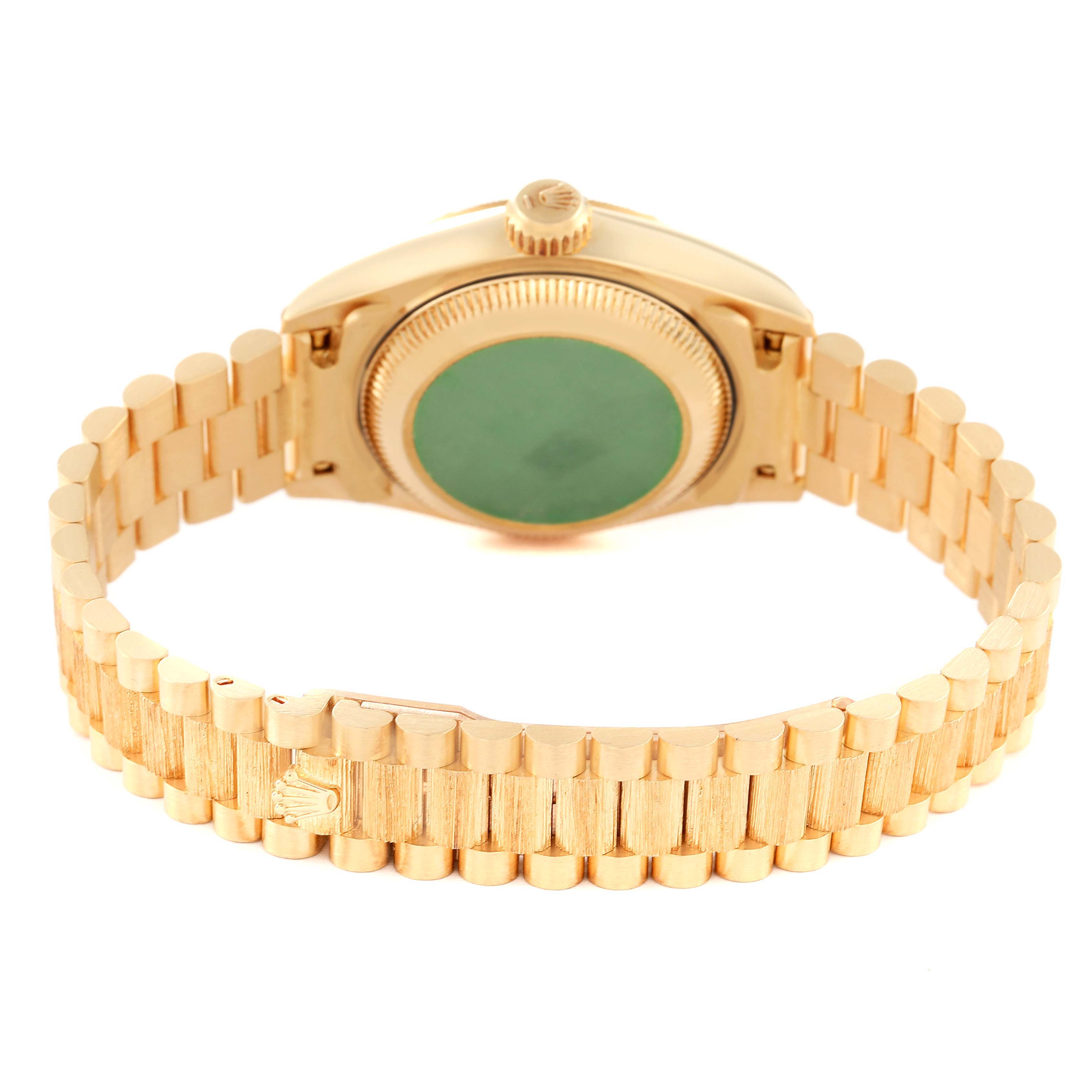 This image shows the back view of a Rolex President 69278 Women
s Yellow Gold Champagne Dial 69278 Women
s Yellow Gold Champagne Dial watch, highlighting the case back and part of the bracelet.