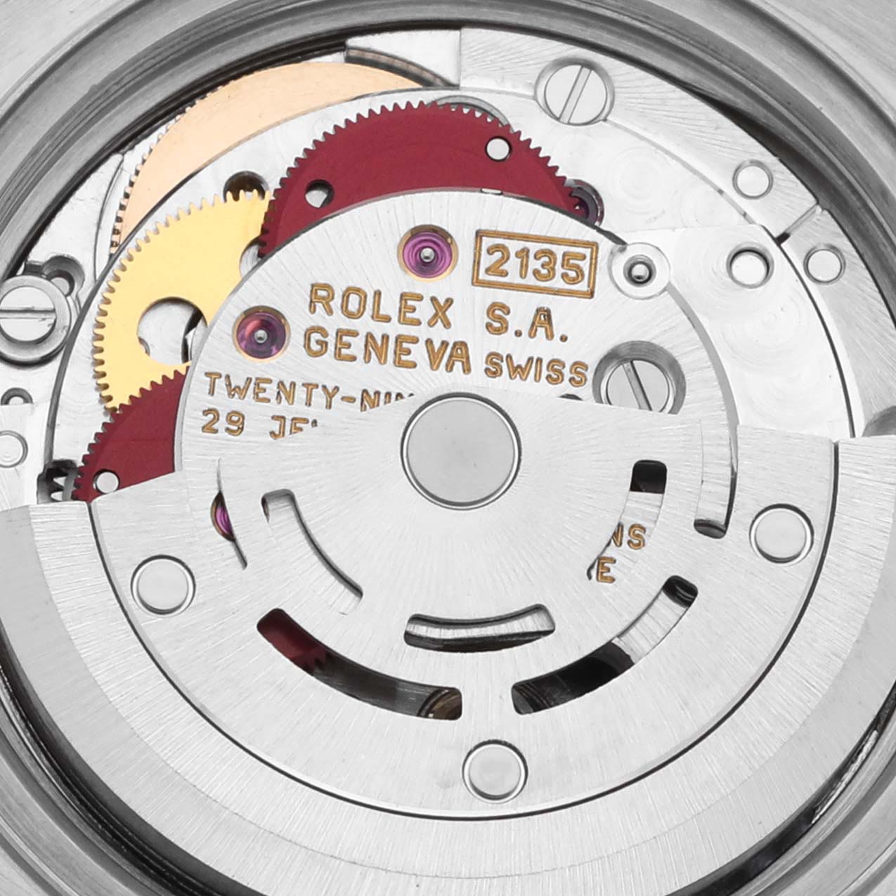 The image shows the internal movement of a Rolex Datejust 69173 Women's Steel and Gold (two tone) Beige Dial 69173 Women's Steel and Gold (two tone) Beige Dial, highlighting the gears, rotor, and inscriptions on the mechanism components.