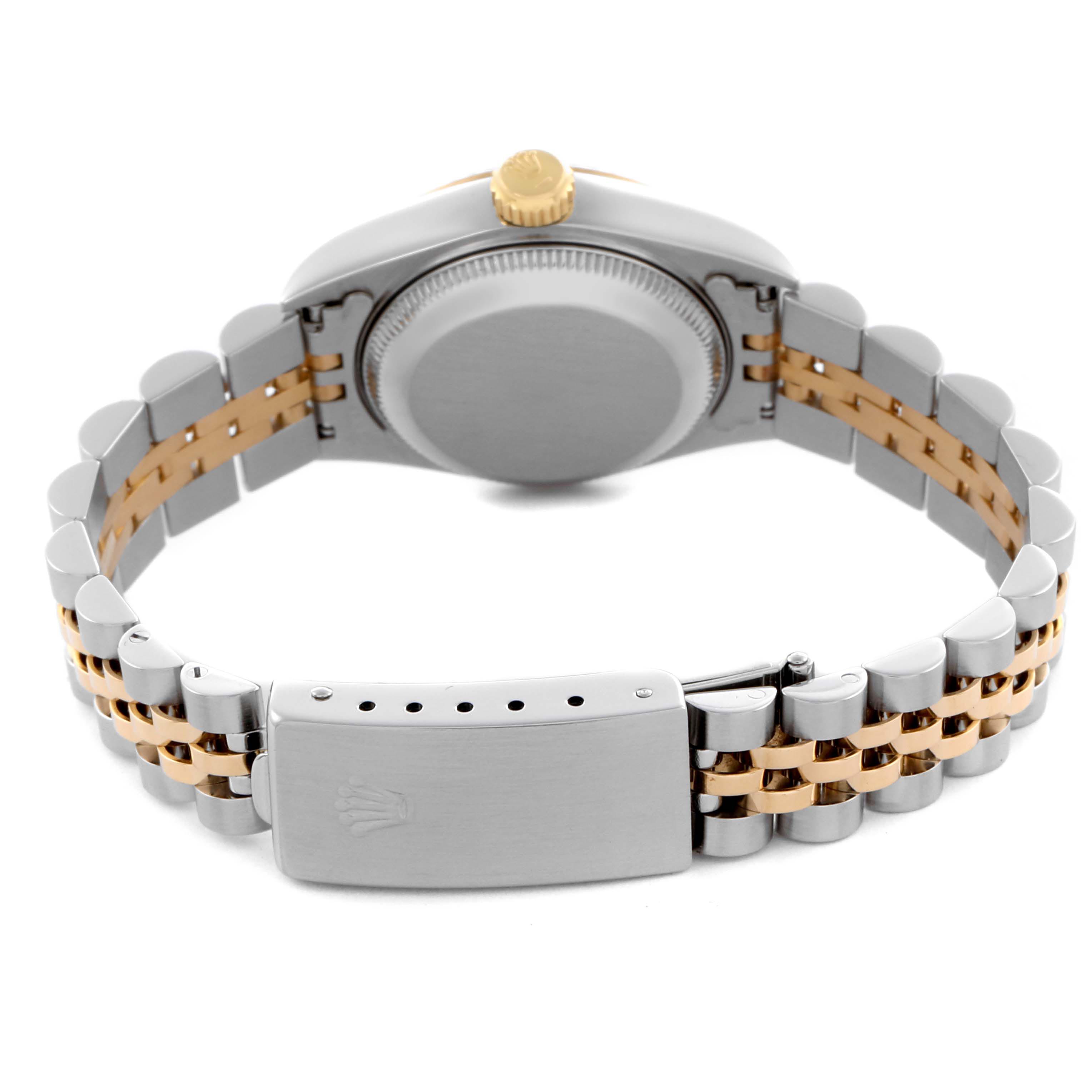 The image shows the backside of a Rolex Datejust 69173 Women's Steel and Gold (two tone) Beige Dial 69173 Women's Steel and Gold (two tone) Beige Dial, highlighting its case back, two-tone bracelet, and clasp.