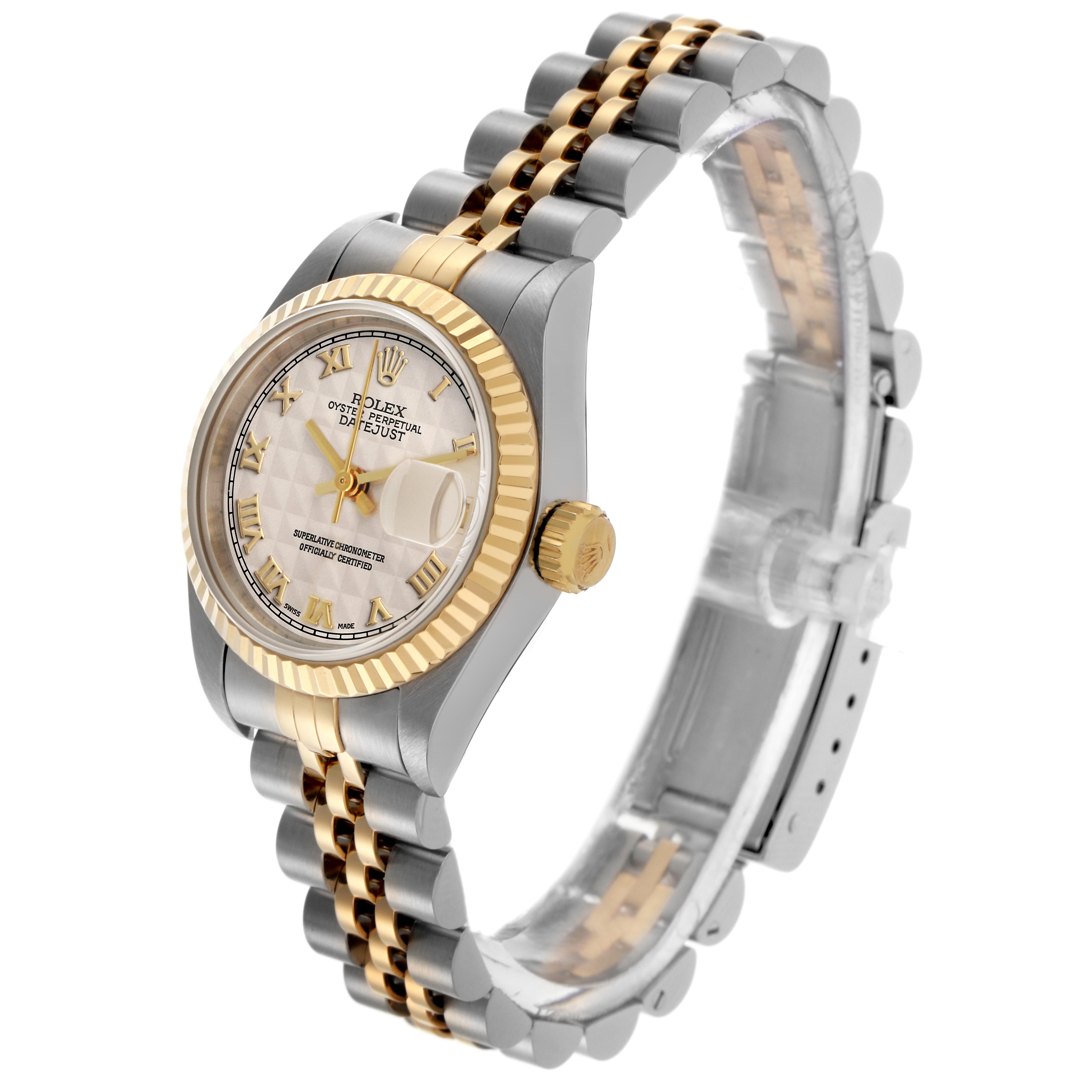 The Rolex Datejust 69173 Women's Steel and Gold (two tone) Beige Dial 69173 Women's Steel and Gold (two tone) Beige Dial watch is shown at an angled side view, highlighting its gold bezel, bracelet, and dial.