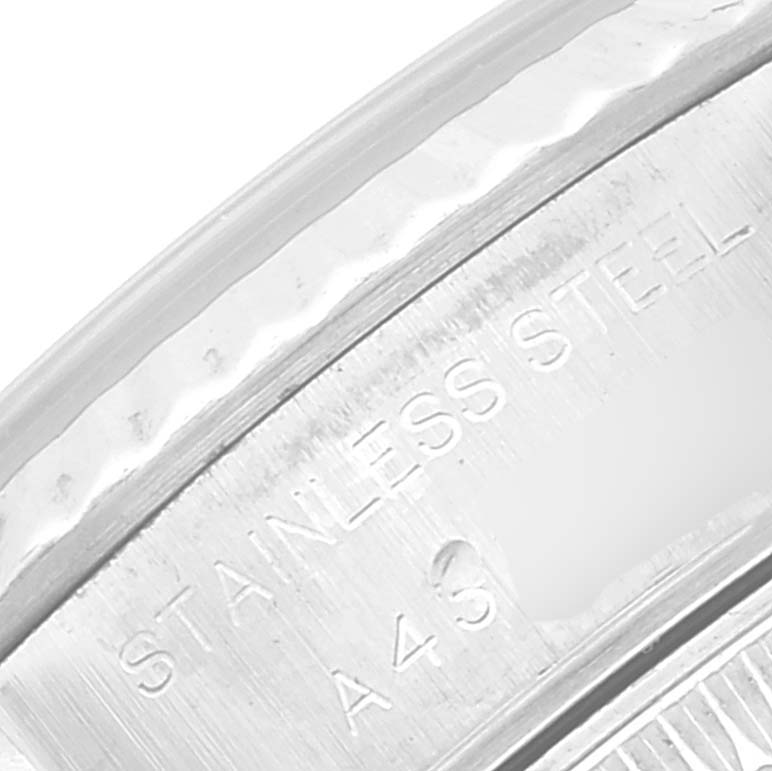 This close-up image shows the stainless steel casing of a Rolex Datejust 69174 Women's Stainless Steel Blue Dial 69174 Women's Stainless Steel Blue Dial watch.