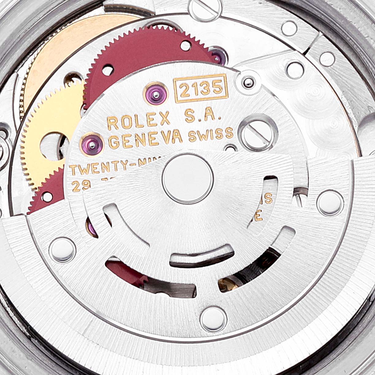 The image shows the movement mechanism of the Rolex Datejust 69174 Women's Stainless Steel Blue Dial 69174 Women's Stainless Steel Blue Dial watch, focusing on its intricate components and engravings.