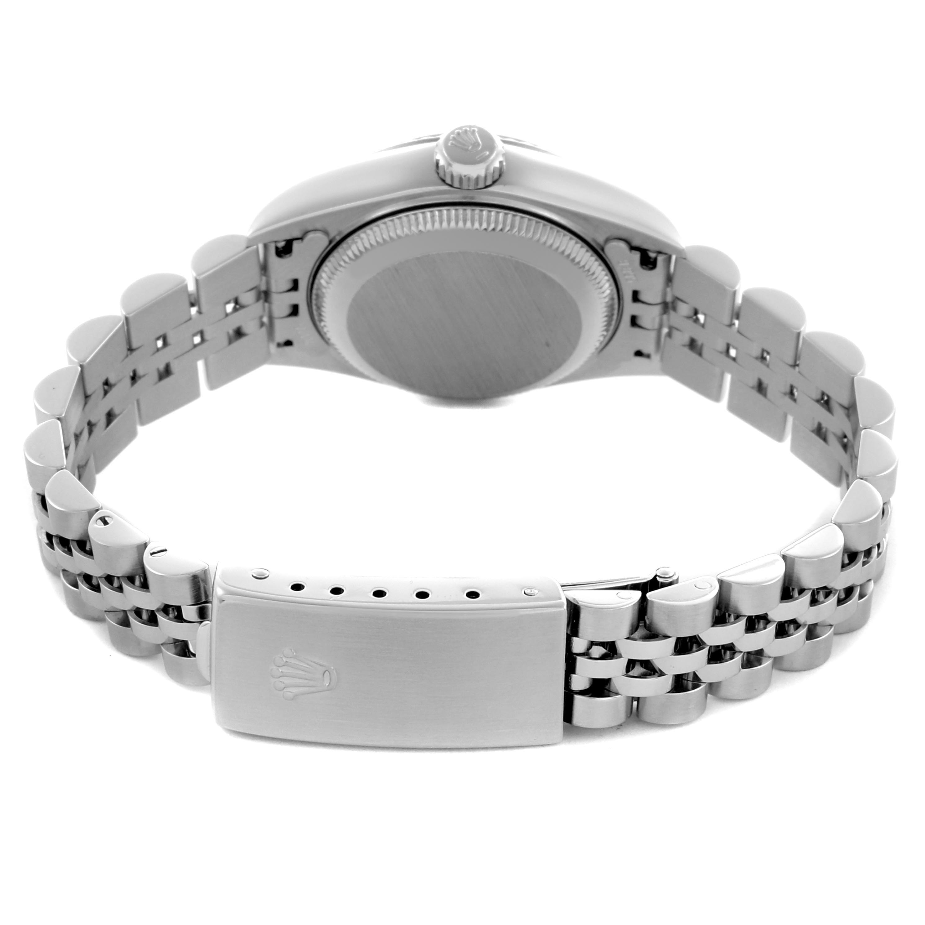 The Rolex Datejust 79174 Women's Stainless Steel Pink Dial 79174 Women's Stainless Steel Pink Dial is shown from the rear, highlighting the case back, crown, and metal bracelet with the clasp visible.