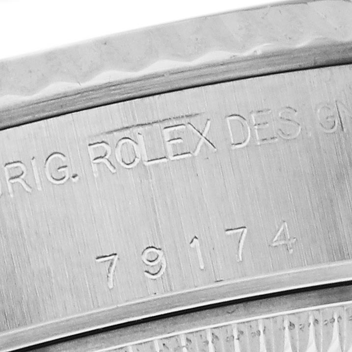 The image shows a close-up of the engraved case back rim of a Rolex Datejust 79174 Women's Stainless Steel Pink Dial 79174 Women's Stainless Steel Pink Dial watch, featuring the model number 79174.