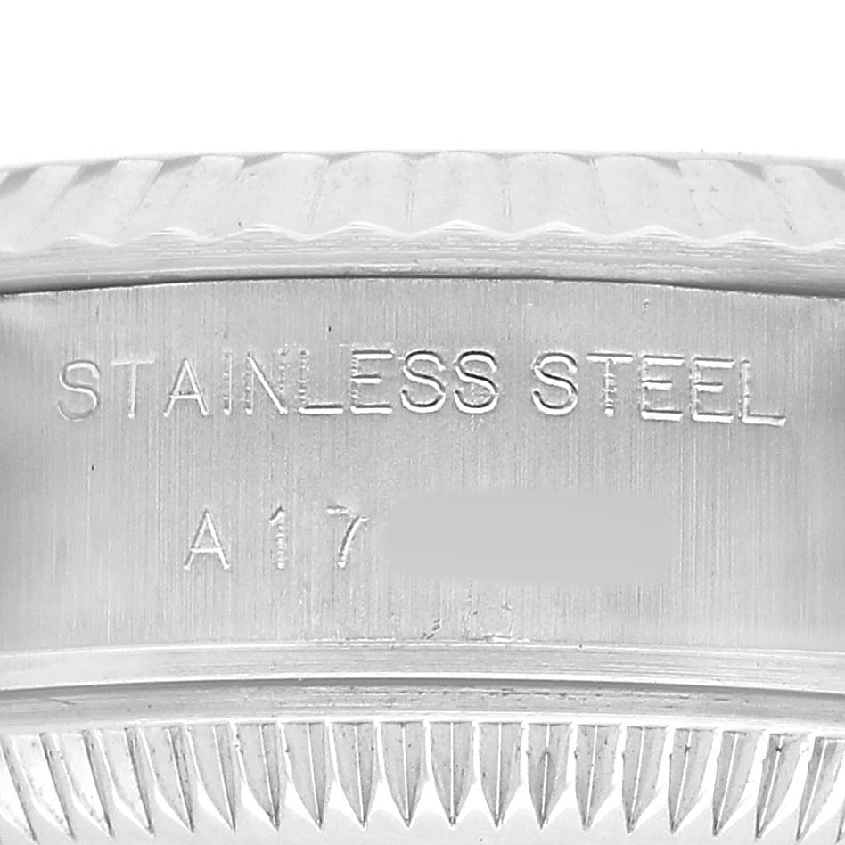 The image shows a close-up of the side engraving on the stainless steel case of a Rolex Datejust 79174 Women's Stainless Steel Pink Dial watch.