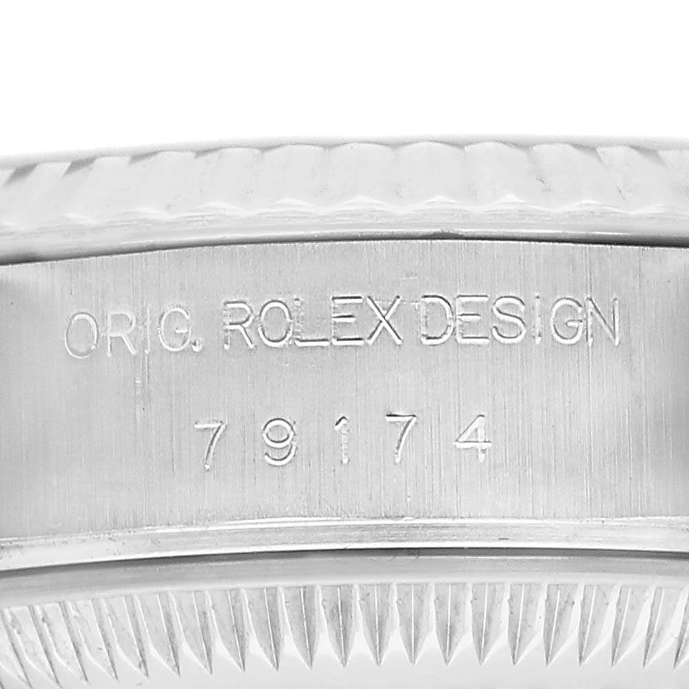 The image shows a close-up of the case side engraving for a Rolex Datejust 79174 Women's Stainless Steel Pink Dial, displaying "ORIG. ROLEX DESIGN" and model number 79174.