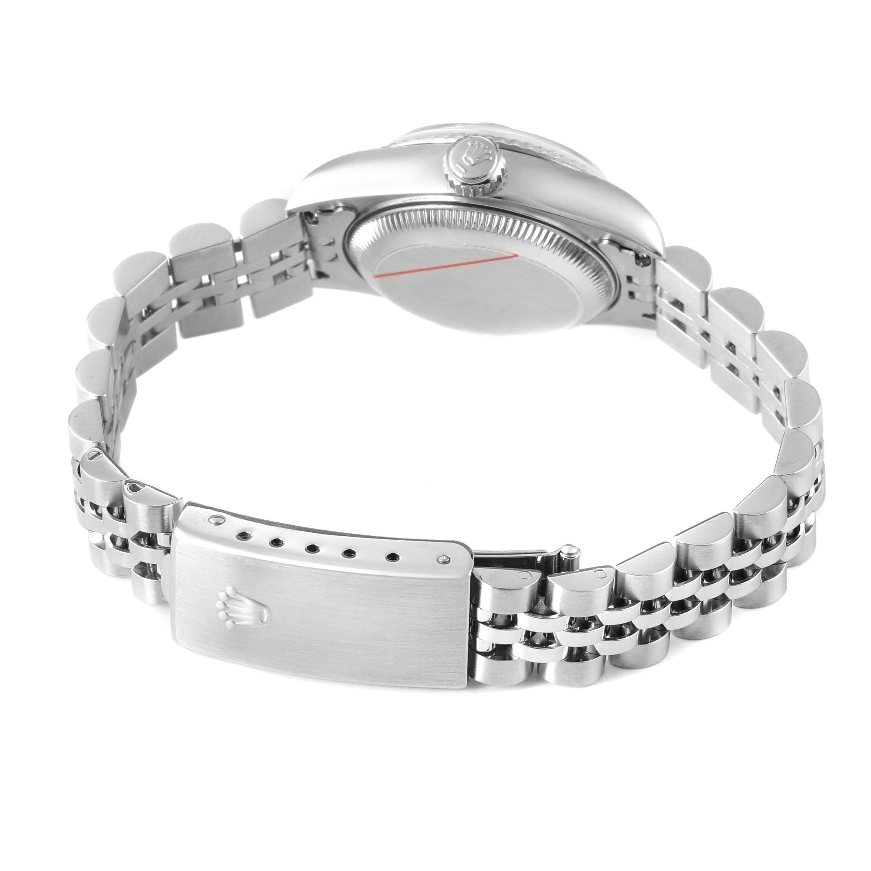 The image shows the side view of a Rolex Datejust 79174 Women's Stainless Steel Pink Dial with its case, crown, and bracelet clasp visible.