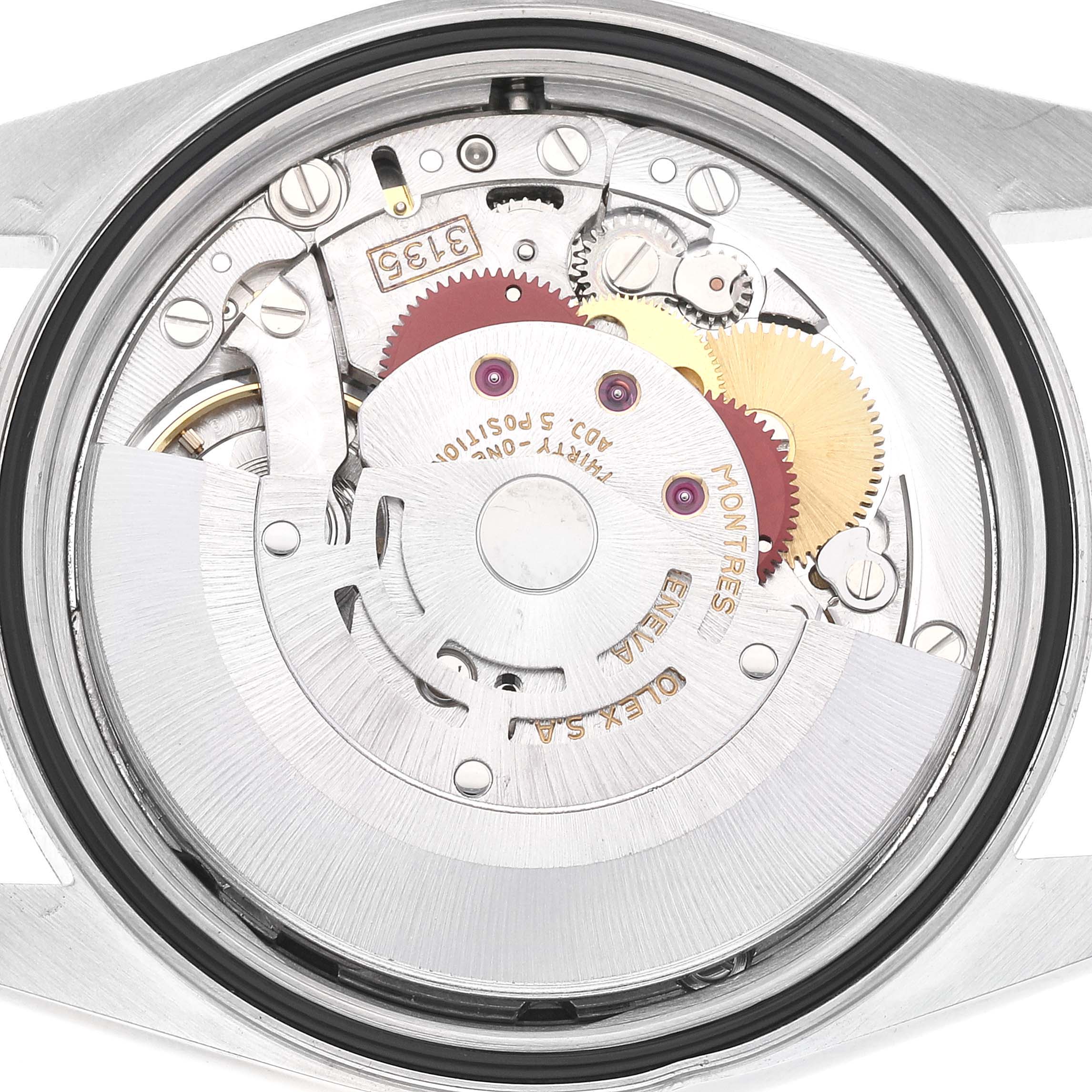 The image shows the intricate inner mechanics of a Rolex Datejust 16233 Men's Steel and Gold (two tone) Blue Dial 16233 Men's Steel and Gold (two tone) Blue Dial watch from a back angle.