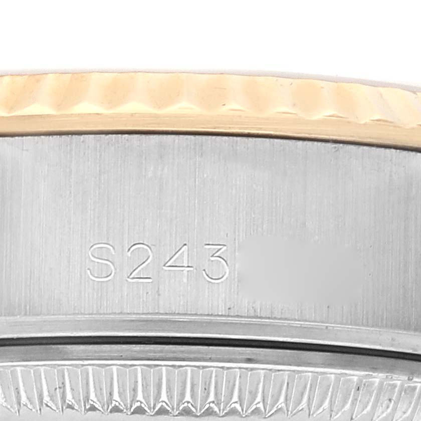 The image shows a close-up of the Rolex Datejust 69173 Women's Steel and Gold (two tone) White Dial 69173 Women's Steel and Gold (two tone) White Dial watch's bezel and case, with part of the serial number visible.