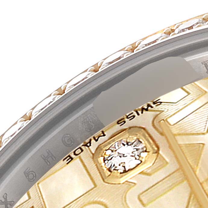 The image shows a close-up of the bezel and part of the dial of a Rolex Datejust 179383 Women's Steel and Gold (two tone) Mother of Pearl Dial 179383 Women's Steel and Gold (two tone) Mother of Pearl Dial watch, highlighting its intricate design and a diamond detail.