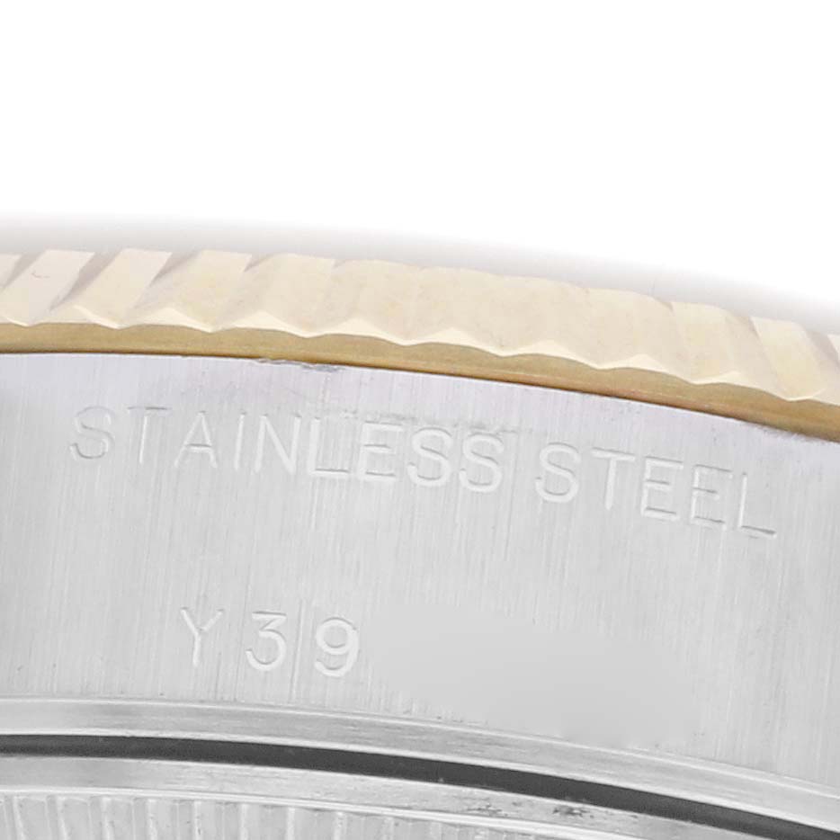 The image shows a close-up of the side of a Rolex Datejust 79173 Women's Steel and Gold (two tone) White Dial 79173 Women's Steel and Gold (two tone) White Dial watch case, highlighting the "STAINLESS STEEL" engraving.
