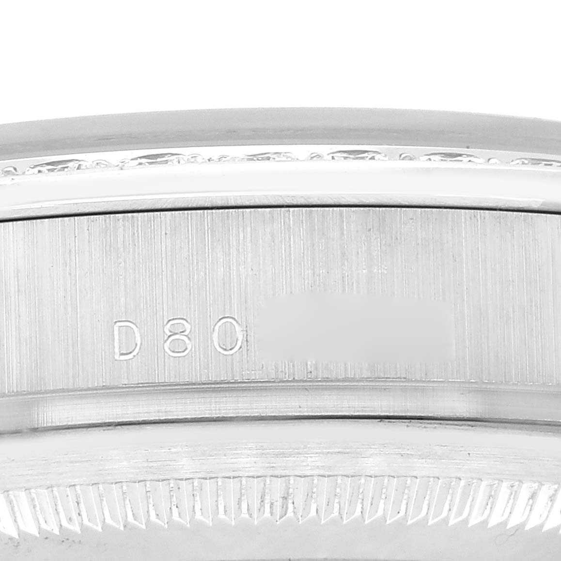 This close-up image shows the case side with a partial serial number of the Rolex President 18946 Men's Platinum Blue Dial 18946 Men's Platinum Blue Dial watch model.