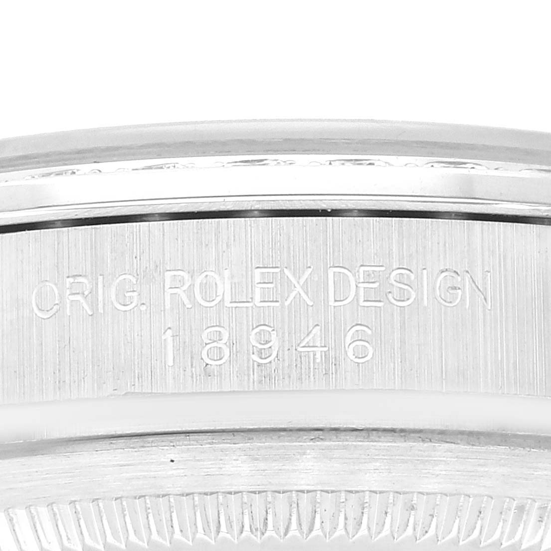 This image shows a close-up of the side of the bezel and caseback, featuring the engraved serial number of the Rolex President 18946 Men's Platinum Blue Dial 18946 Men's Platinum Blue Dial model.
