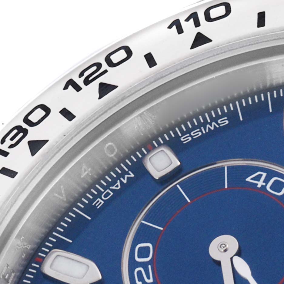 The image shows the bezel and part of the dial of a Rolex Daytona 116509 Men's White Gold Blue Dial 116509 Men's White Gold Blue Dial, focusing on the tachymetric scale and seconds subdial.