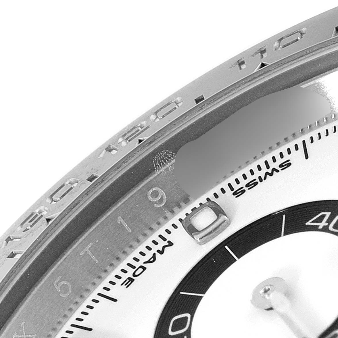 The image shows a close-up view of the bezel, dial, and markings of a Rolex Daytona 116500 Men's Stainless Steel White Dial 116500 Men's Stainless Steel White Dial watch.