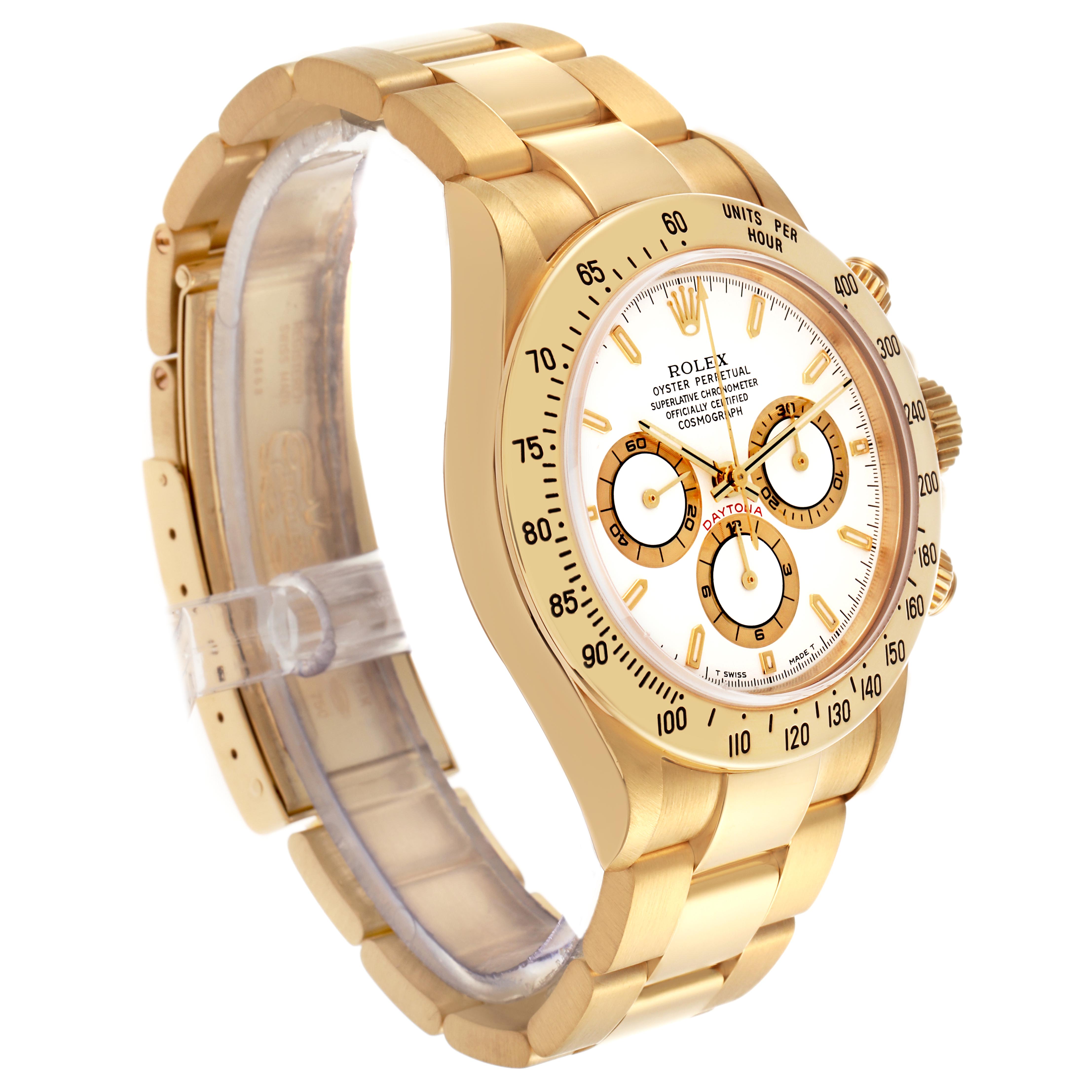 The Rolex Daytona 16528 Men's Yellow Gold White Dial 16528 Men's Yellow Gold White Dial watch is shown at a slight side angle, displaying its gold bracelet, bezel, dial, and crown.