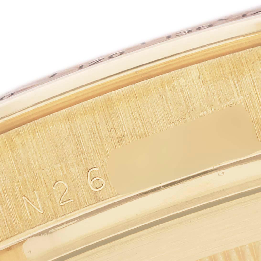 This image shows an angled close-up of the case side of a Rolex Daytona 16528 Men's Yellow Gold White Dial 16528 Men's Yellow Gold White Dial, highlighting the engraved model details.