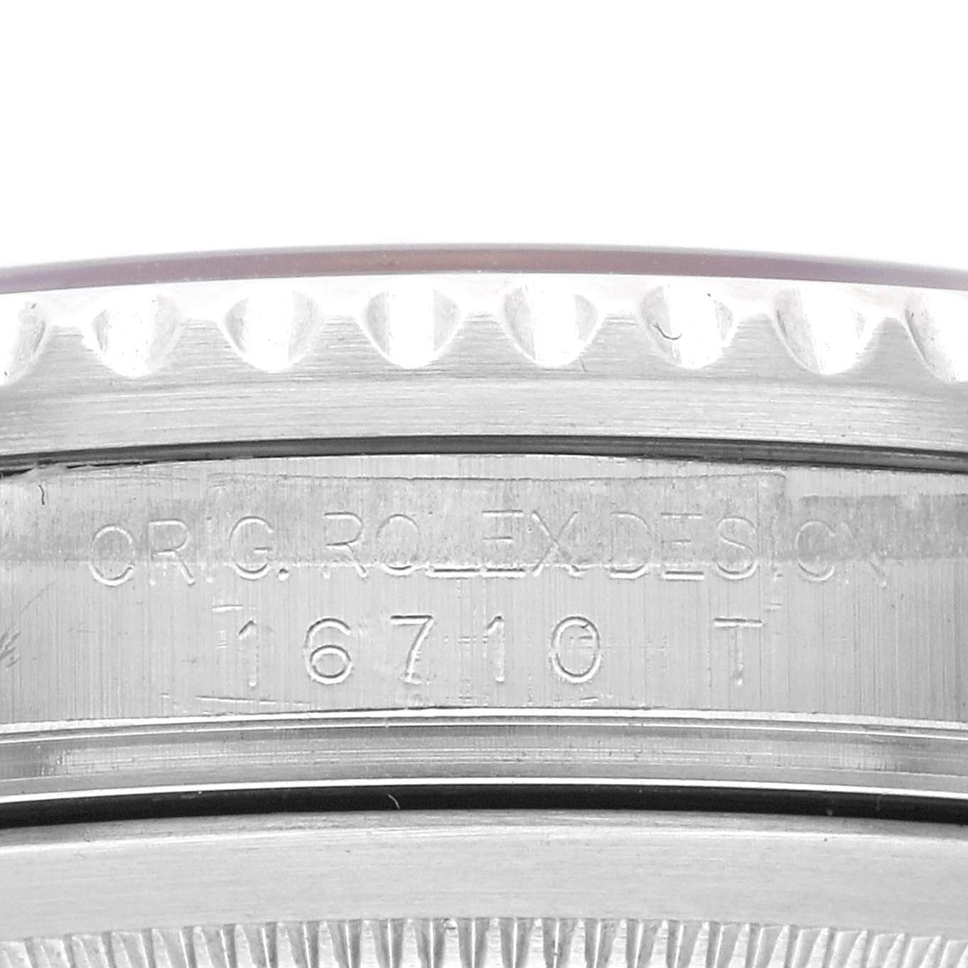 This close-up image shows the side case of the Rolex GMT-Master 16710 Men's Stainless Steel Black Dial 16710 Men's Stainless Steel Black Dial model 16710, focusing on the model's engraving.