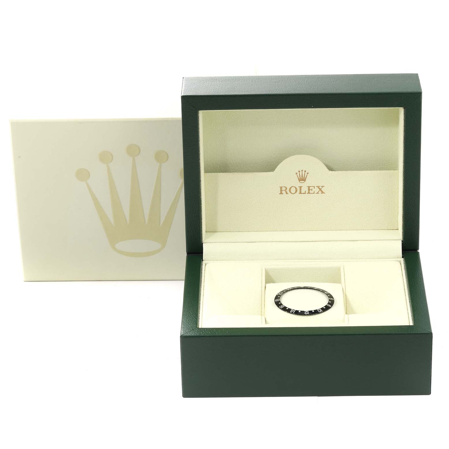 The image shows a bezel for the Rolex GMT-Master 16710 Men's Stainless Steel Black Dial 16710 Men's Stainless Steel Black Dial model placed inside a Rolex box at a slight angle.