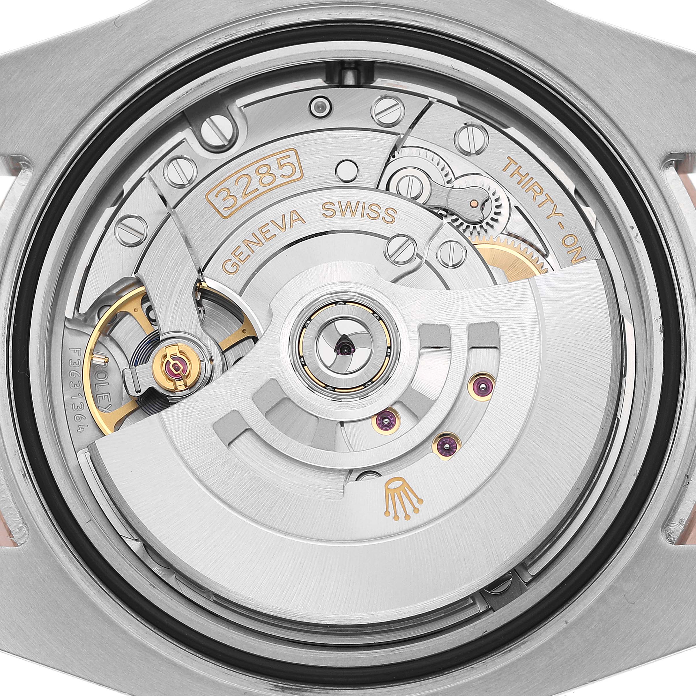 The image shows the movement of a Rolex GMT-Master 126711 Men's Steel and Gold (two tone) Black Dial watch from the back, highlighting its intricate mechanics and rotor.