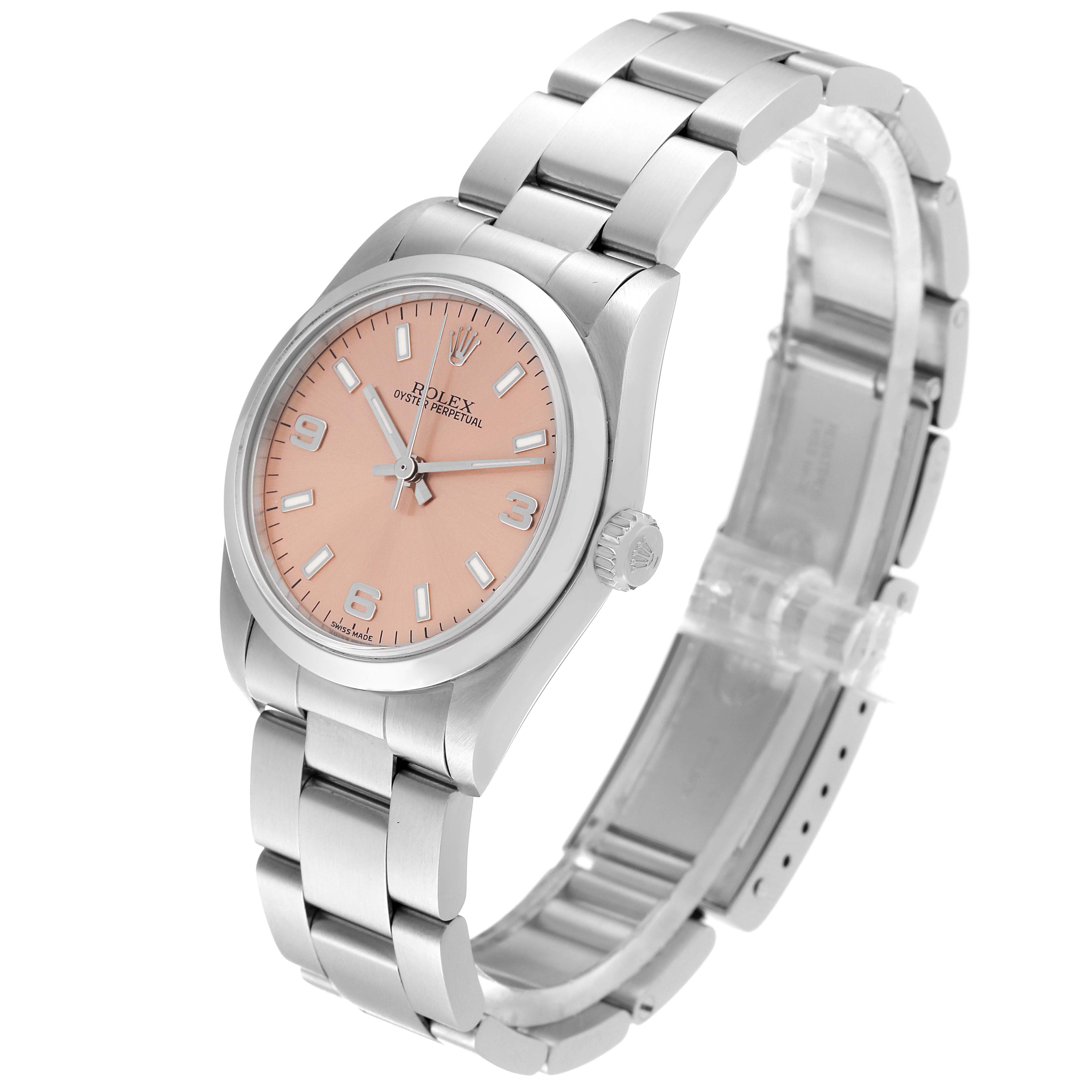 The Rolex Mid-Size 77080 Women's Stainless Steel Pink Dial 77080 Women's Stainless Steel Pink Dial Oyster Perpetual watch is shown at an oblique angle, highlighting its bracelet, dial, bezel, and crown.