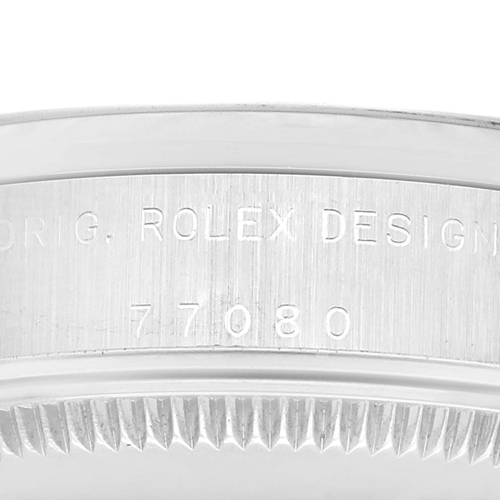 The image shows the side profile of a mid-size Rolex watch, highlighting the engraved model number 77080 and the "ROLEX DESIGN" text.