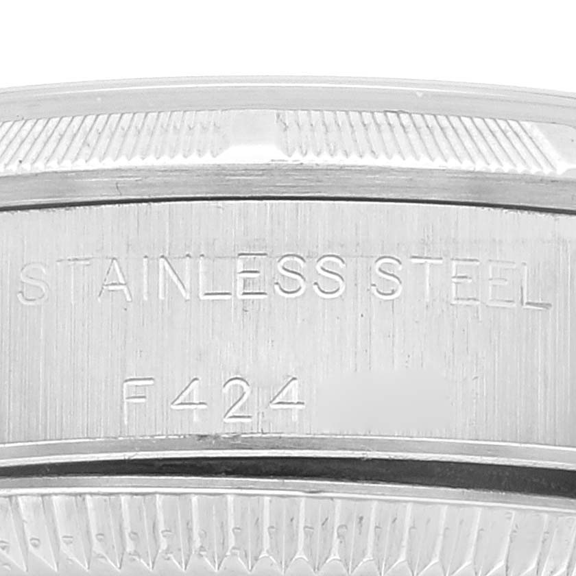 This close-up image shows the stainless steel case back of a Rolex Oyster Perpetual 76030 Women's Stainless Steel Silver Dial 76030 Women's Stainless Steel Silver Dial watch.