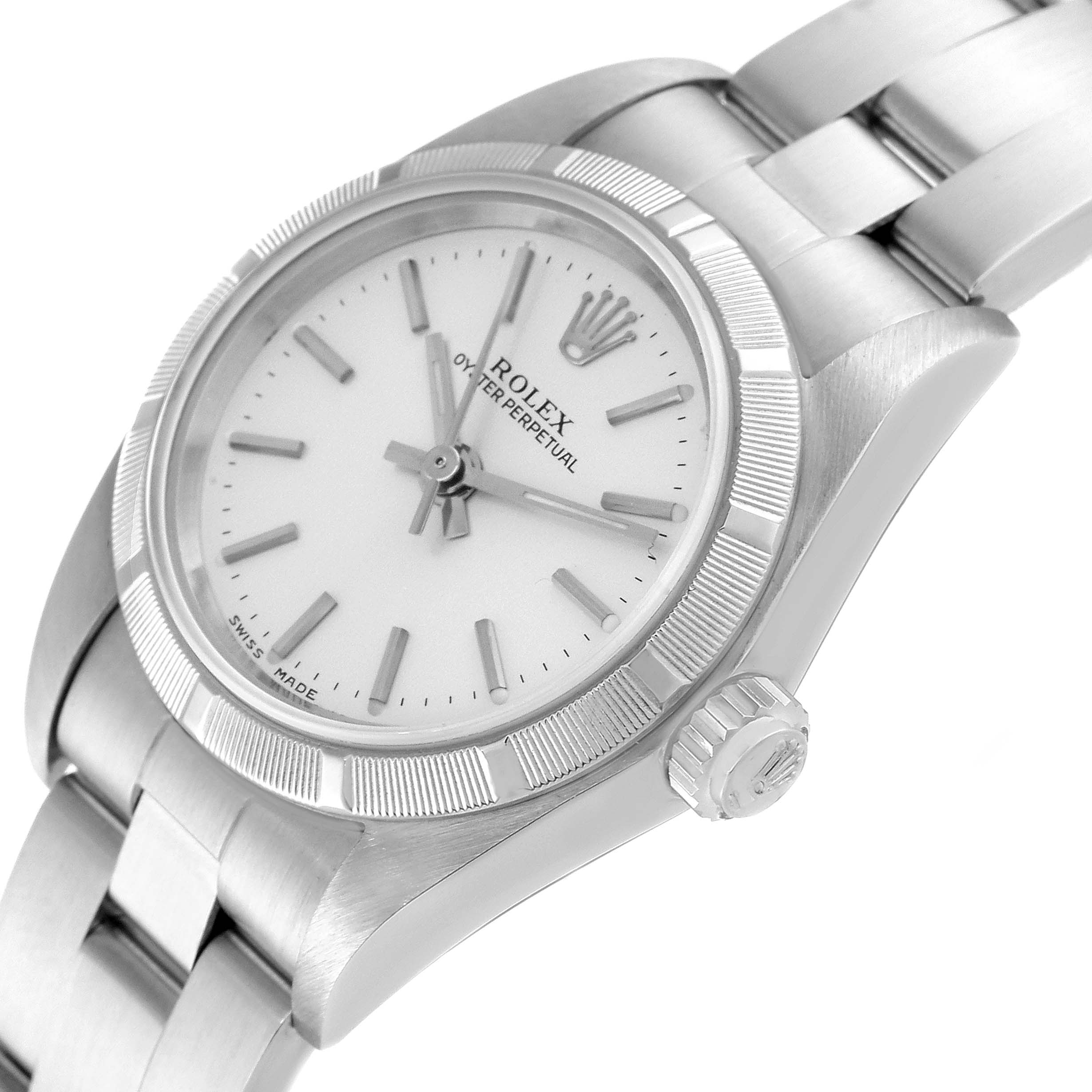 The Rolex Oyster Perpetual 76030 Women's Stainless Steel Silver Dial 76030 Women's Stainless Steel Silver Dial watch is shown from a slightly angled perspective, highlighting the face, bezel, crown, and part of the bracelet.