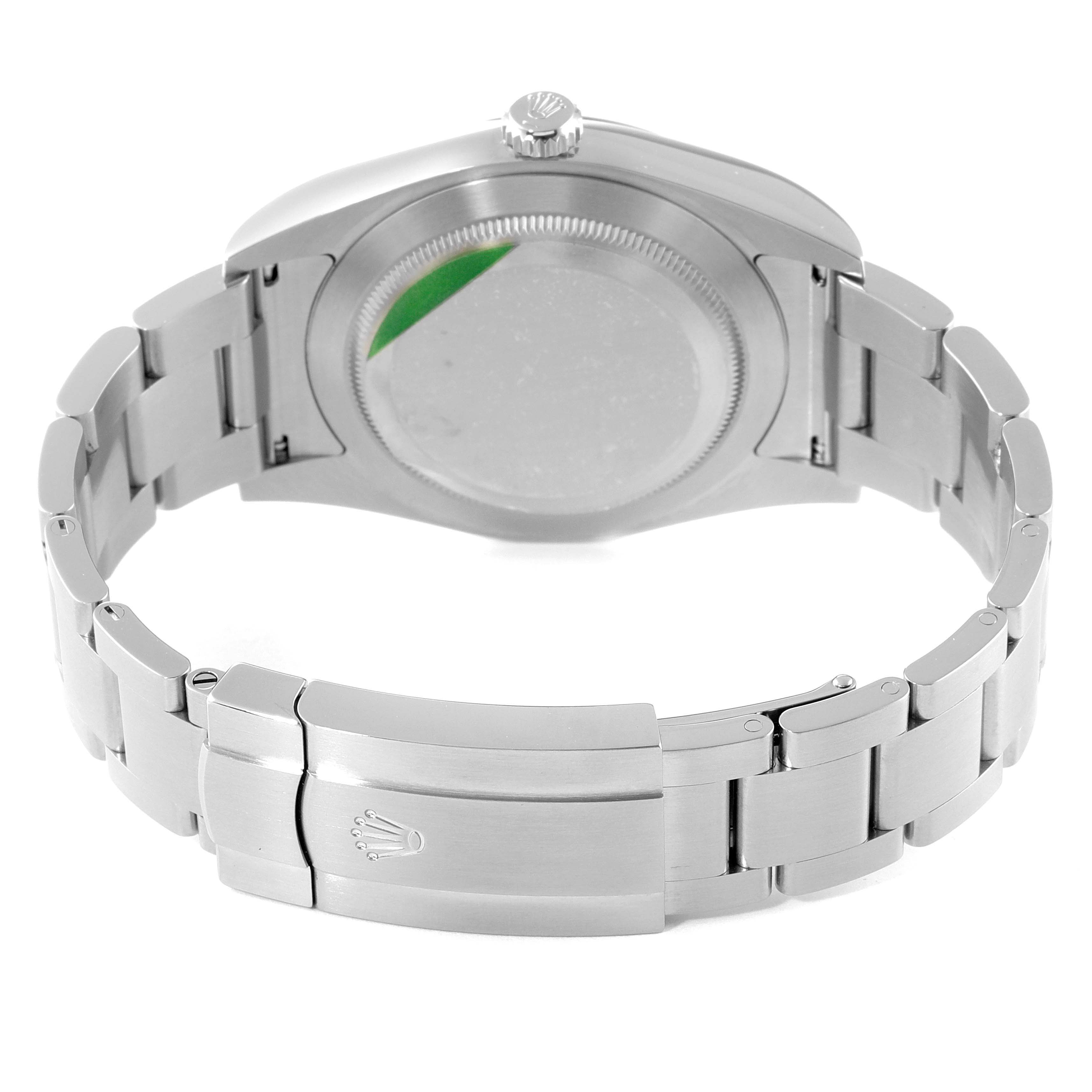 The image shows the back view of a Rolex Oyster Perpetual 114300 Men's Stainless Steel Silver Dial 114300 Men's Stainless Steel Silver Dial watch, highlighting the case back and bracelet with the closed clasp.