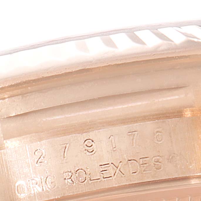 This image shows a close-up of the inner side of the bezel and engraved serial number of the Rolex President 279175 Women
s Rose Gold Brown Dial 279175 Women
s Rose Gold Brown Dial model.