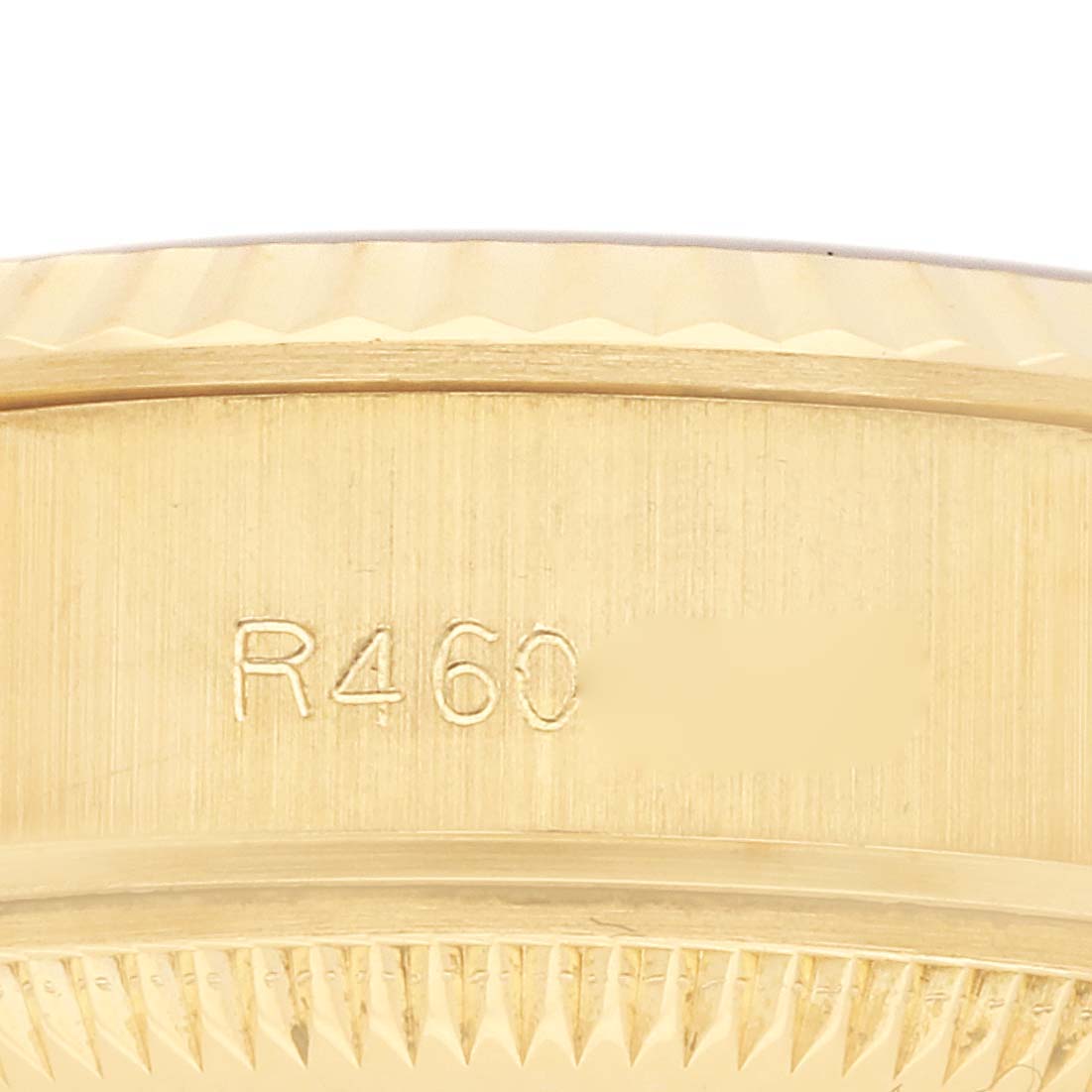 The image shows a side view of the case edge with engravings on a Rolex President 69178 Women
s Yellow Gold Champagne Dial 69178 Women
s Yellow Gold Champagne Dial model.