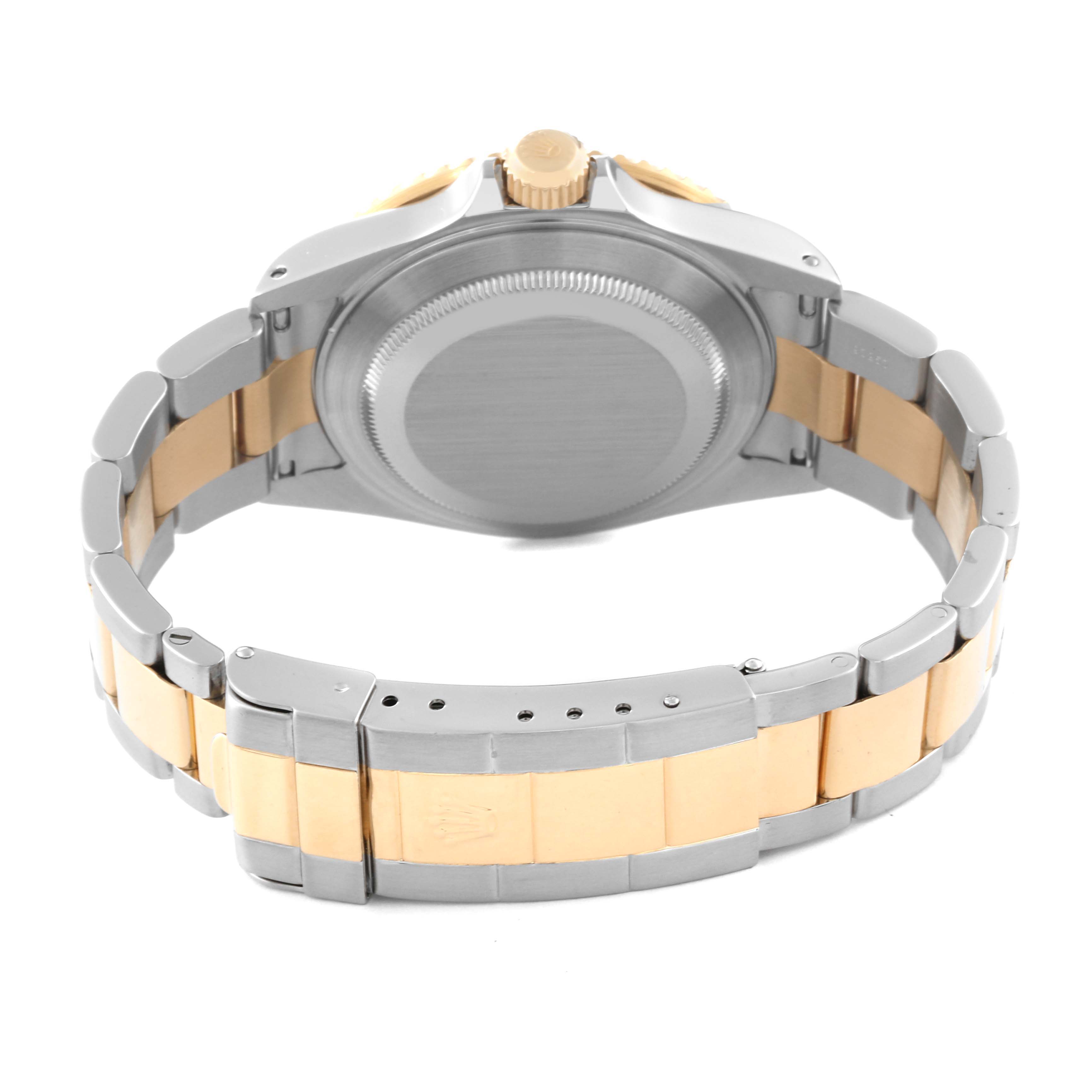 This image shows the back view of a Rolex Submariner 16613 Men's Steel and Gold (two tone) Blue Dial 16613 Men's Steel and Gold (two tone) Blue Dial, highlighting the case back, bracelet, and clasp.