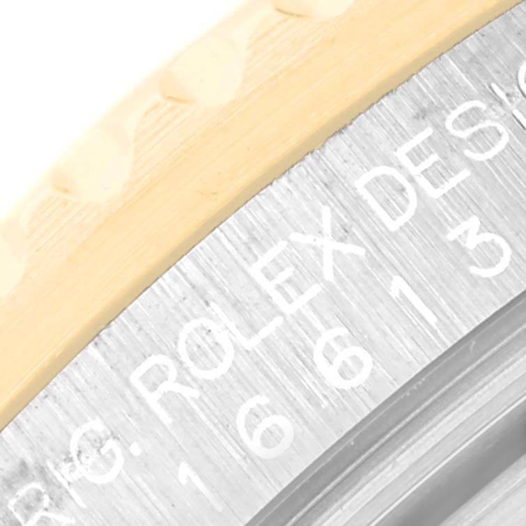 The image shows a close-up of the bezel and engraved side of a Rolex Submariner 16613 Men's Steel and Gold (two tone) Blue Dial 16613 Men's Steel and Gold (two tone) Blue Dial watch, highlighting the model number and branding.