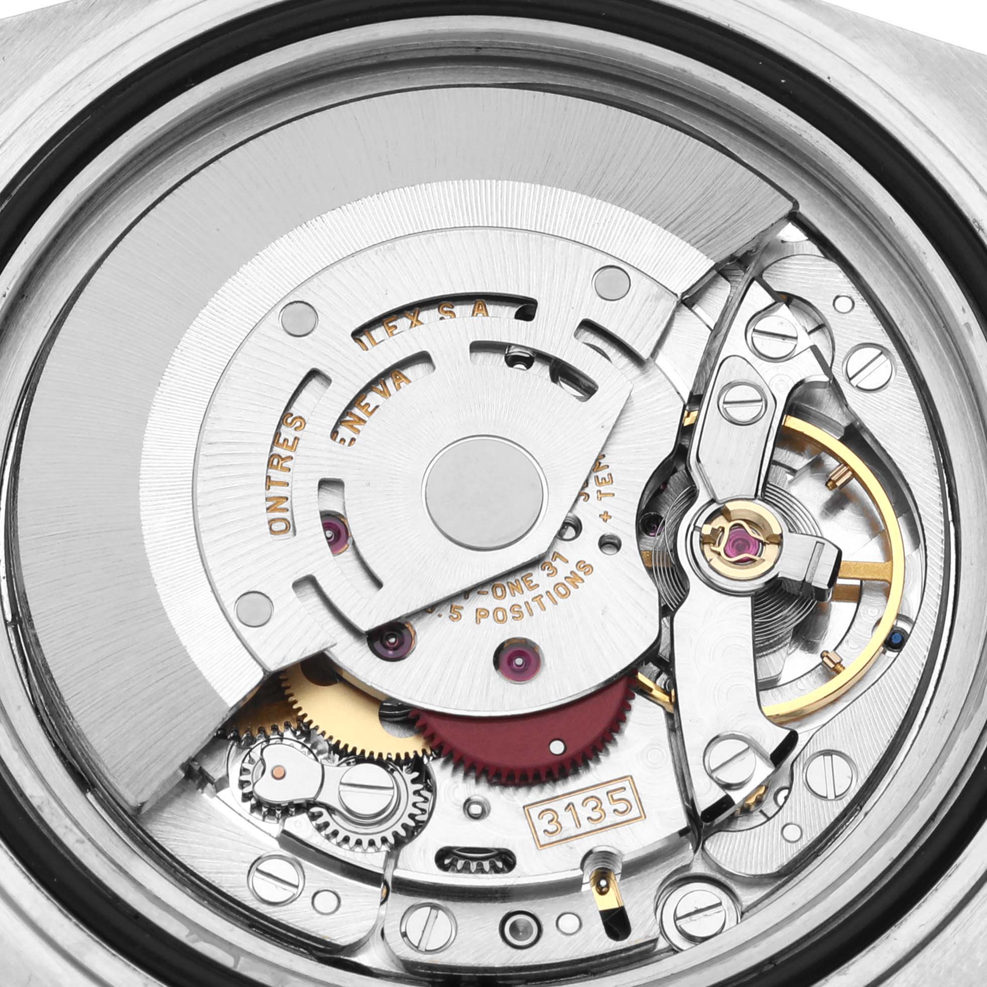 This close-up image shows the intricate movement parts of a Rolex Submariner 16613 Men's Steel and Gold (two tone) Blue Dial 16613 Men's Steel and Gold (two tone) Blue Dial watch.