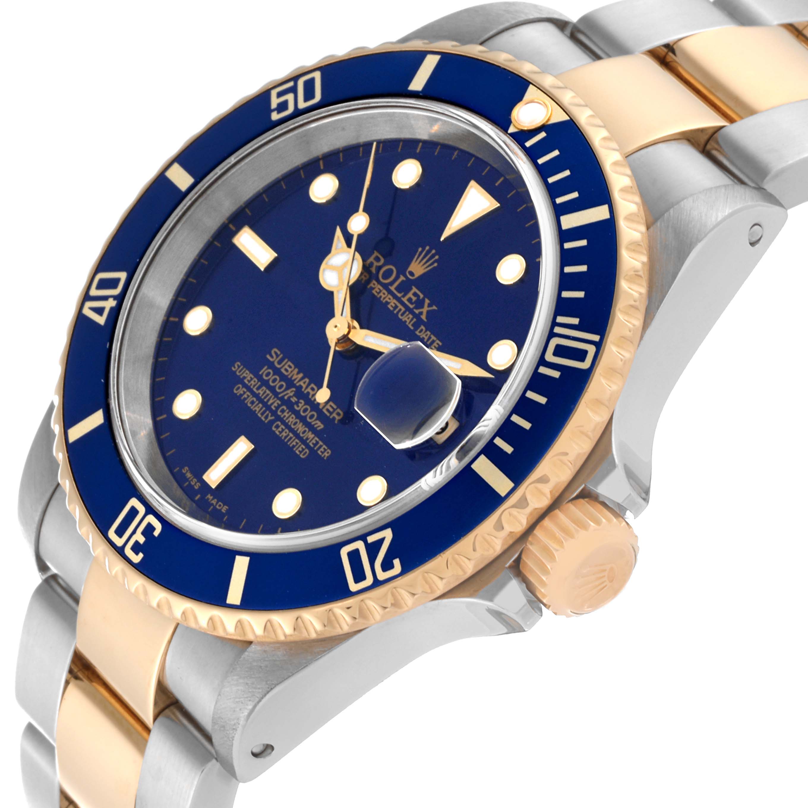 The image shows a close-up angled view of a Rolex Submariner 16613 Men's Steel and Gold (two tone) Blue Dial 16613 Men's Steel and Gold (two tone) Blue Dial watch, highlighting the blue dial, bezel, and crown.