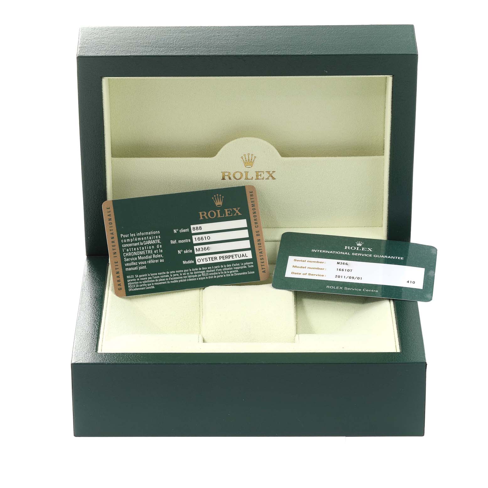 The image shows an open Rolex Submariner 16610T Men
s Stainless Steel Black Dial 16610T Men
s Stainless Steel Black Dial watch box containing warranty and other certification cards.