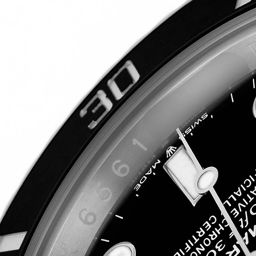 This close-up of a Rolex Submariner 124060 Men's Stainless Steel Black Dial shows part of the dial, including an hour marker, and a portion of the rotating bezel with the number "30".