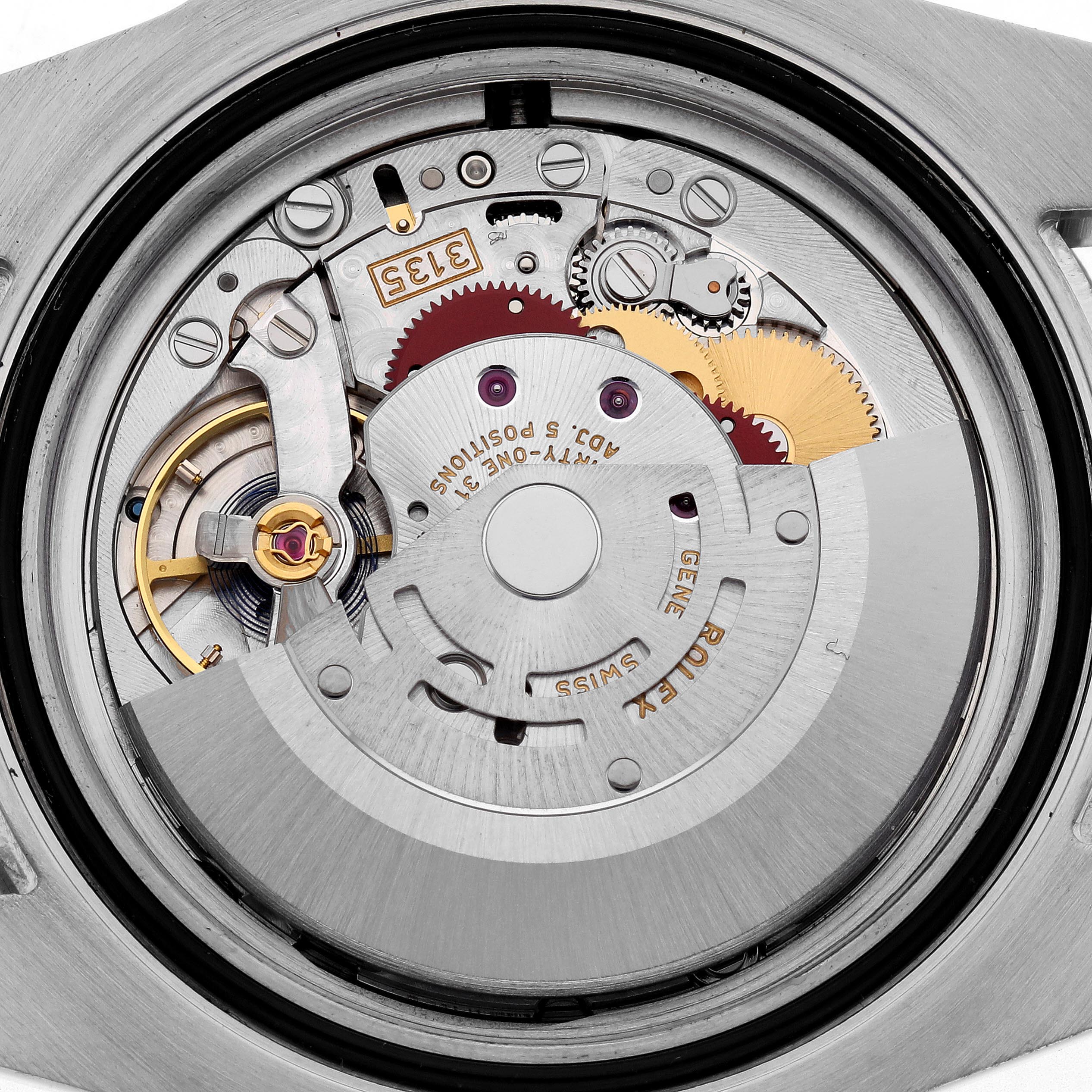 The image shows the movement of a Rolex Submariner 116613LB Men's Steel and Gold (two tone) Blue Dial 116613LB Men's Steel and Gold (two tone) Blue Dial watch from a rear angle, highlighting gears and the rotor.