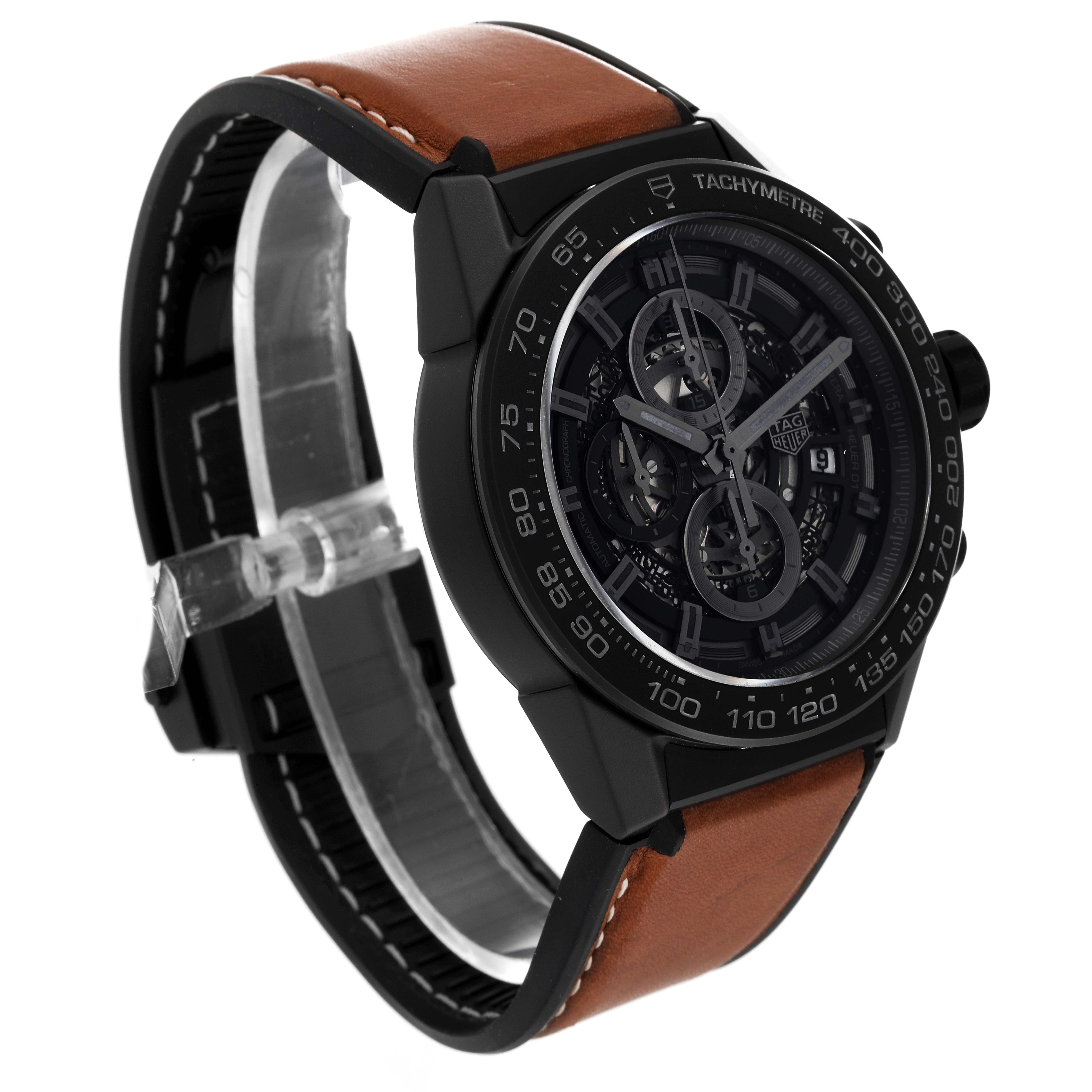 The Carrera model by Tag Heuer is shown from a front angle, displaying the face, bezel, and leather strap.