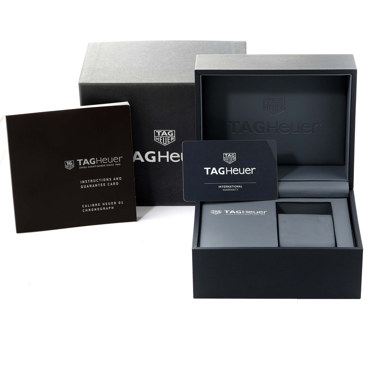 The image shows the packaging, guarantee card, instructions, and warranty card for a Tag Heuer Carrera CAR2A91 Men's Ceramic Black Dial CAR2A91 Men's Ceramic Black Dial model.