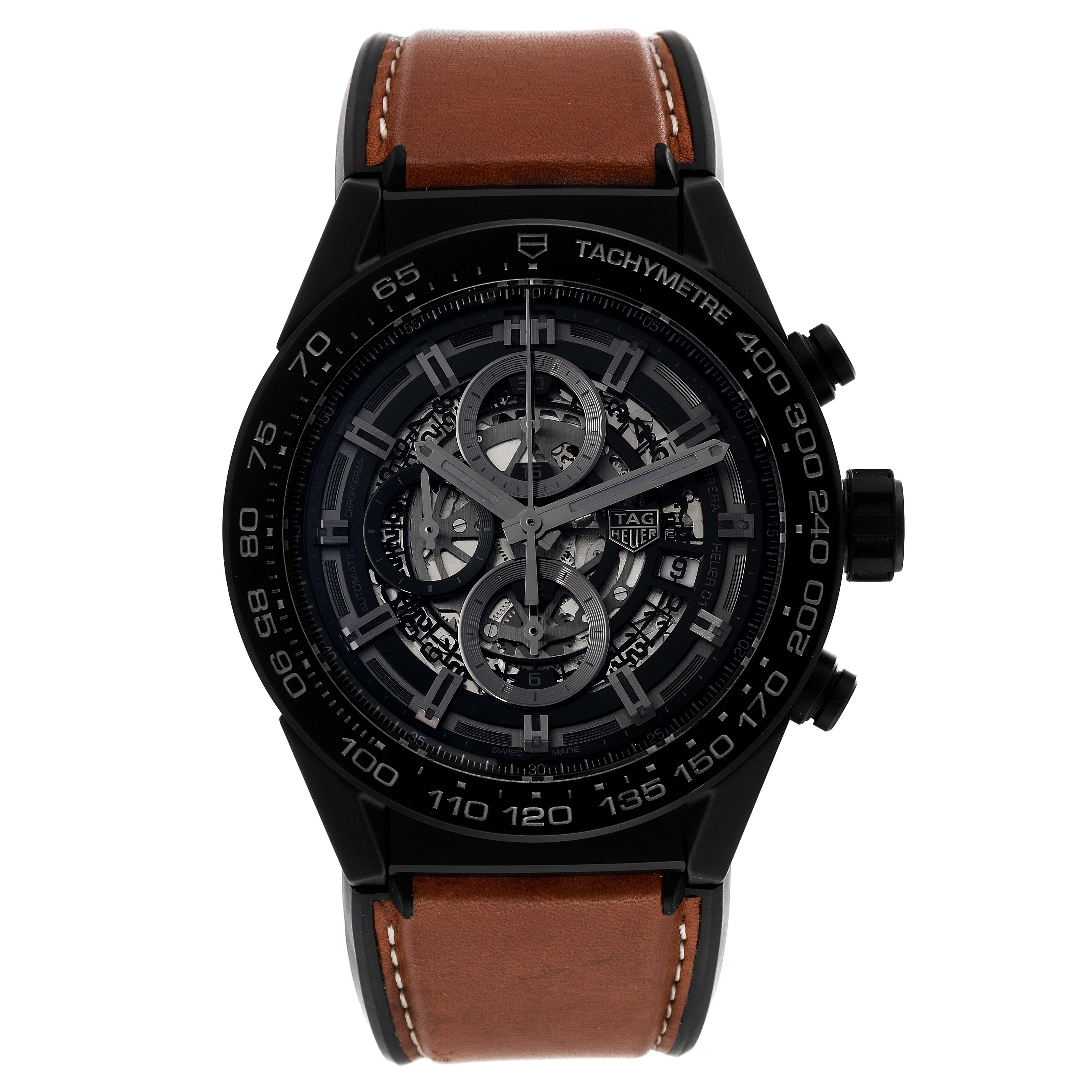 The image shows a frontal view of a Tag Heuer Carrera CAR2A91 Men's Ceramic Black Dial CAR2A91 Men's Ceramic Black Dial watch with a skeleton dial and a brown leather strap.