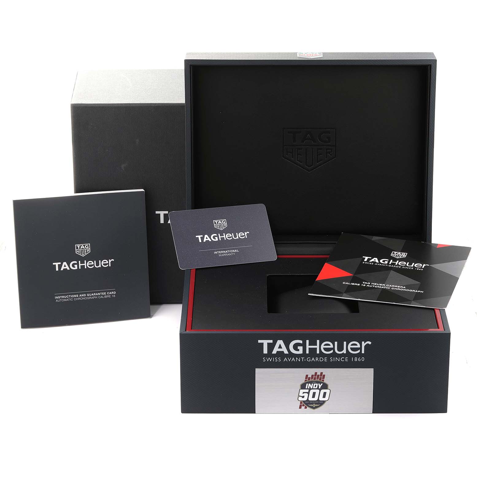 The image shows a Tag Heuer Carrera CV201AS.FC6429 Men's Stainless Steel Black Dial CV201AS.FC6429 Men's Stainless Steel Black Dial watch box, international warranty card, instruction manuals, and enclosed packaging.