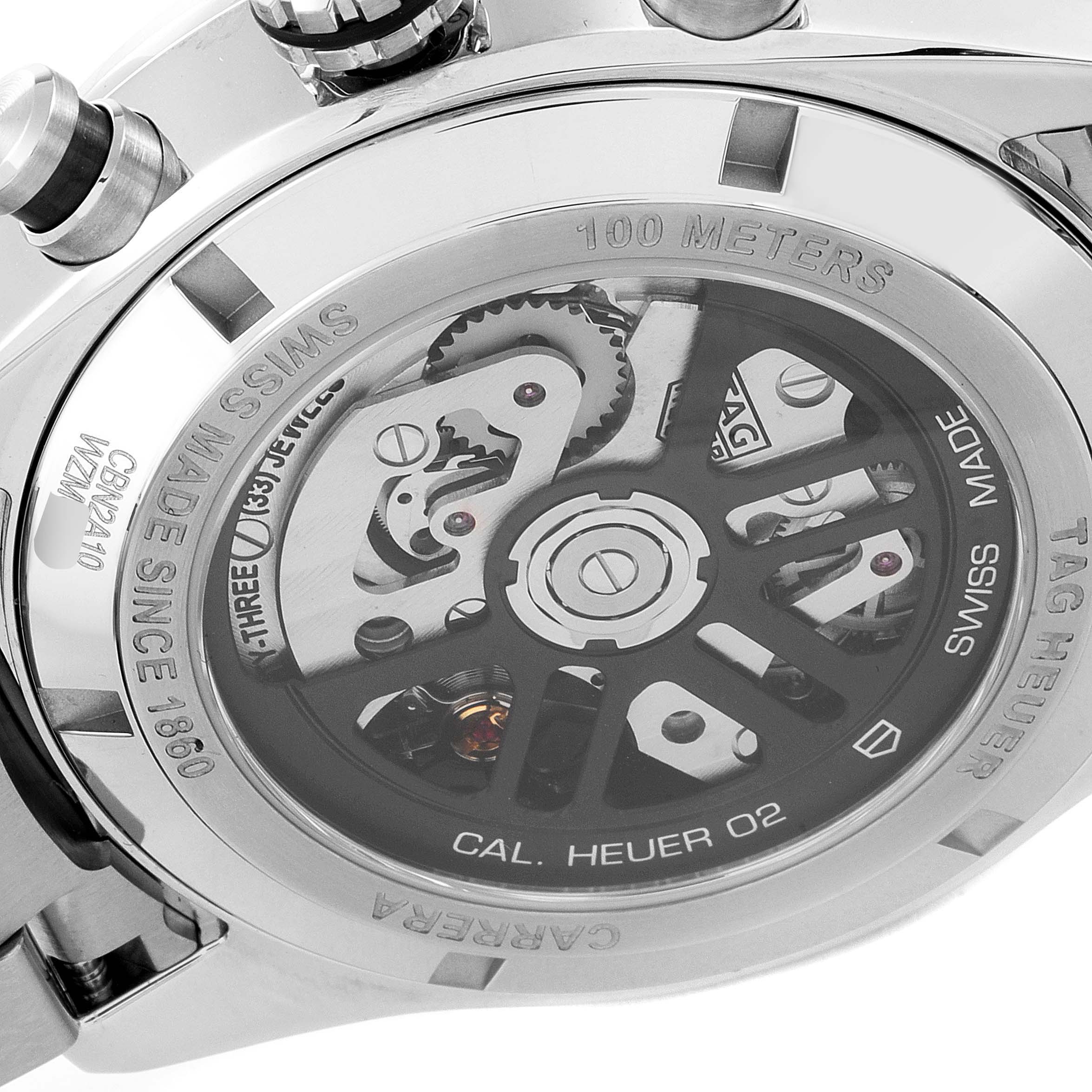 The image shows the back view of the Tag Heuer Carrera CBN2A10.BA0643 Men's Stainless Steel Green Dial CBN2A10.BA0643 Men's Stainless Steel Green Dial watch, highlighting its inner mechanics and inscriptions.